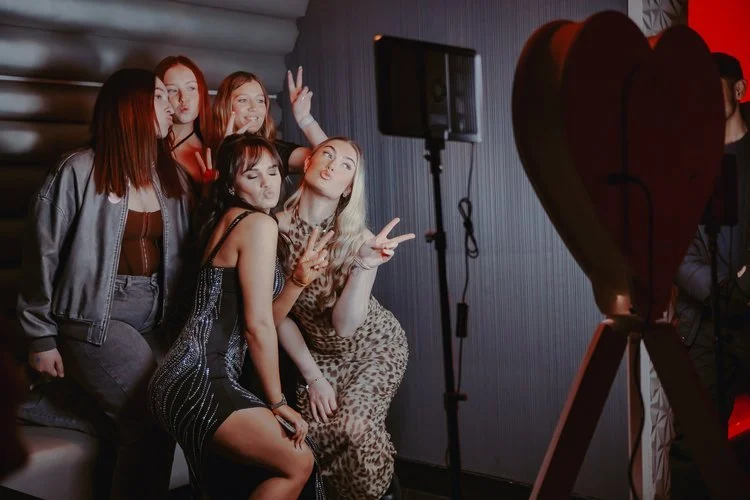 Guests strike playful poses in front of Mark the Event’s signature heart-shaped photo booth, capturing the energy and excitement of the celebration. With stylish outfits, confident smiles, and the perfect lighting, this setup shows how the booth brin