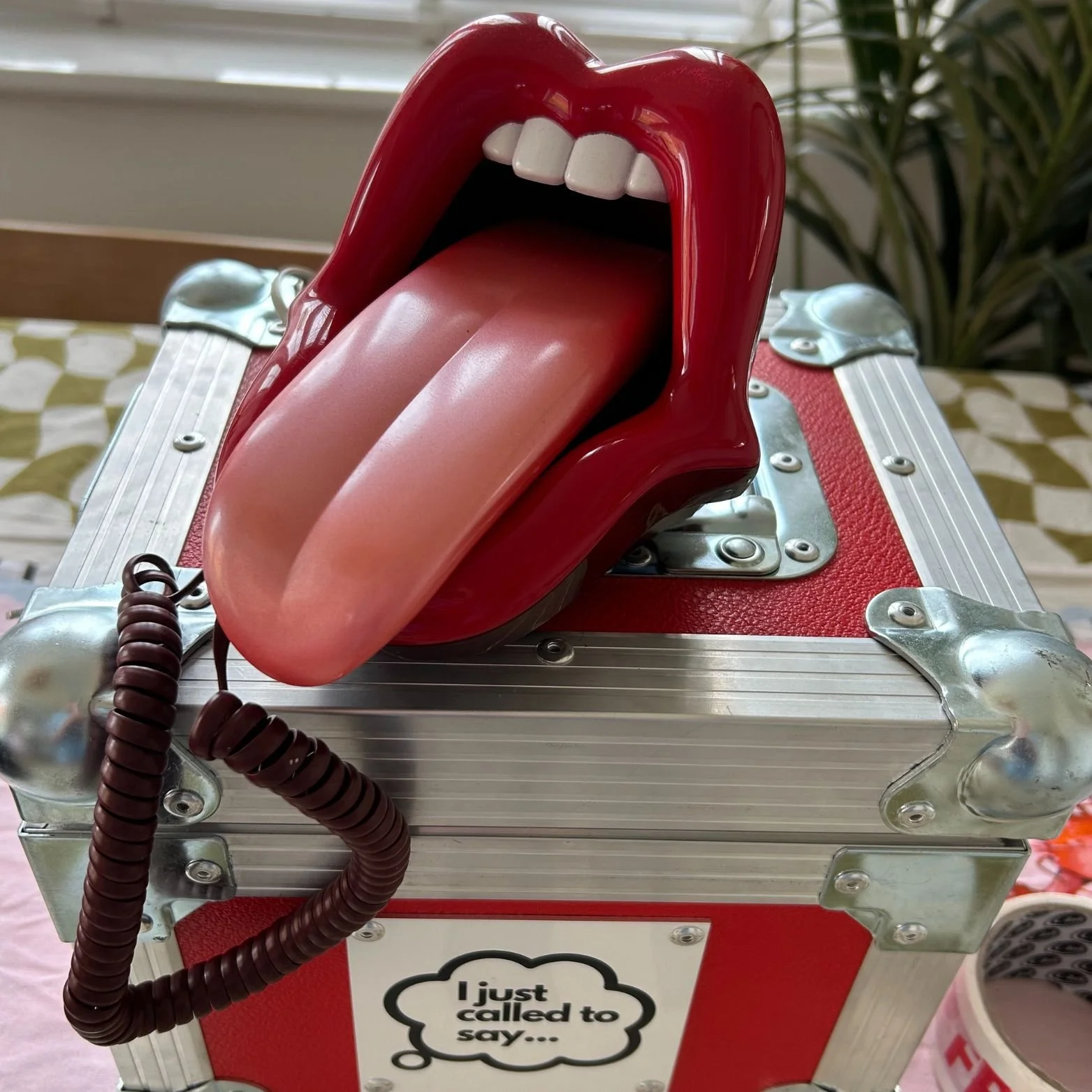 The I Just Called To Say 'Big Mouth' phone sitting on a bespoke flight case.