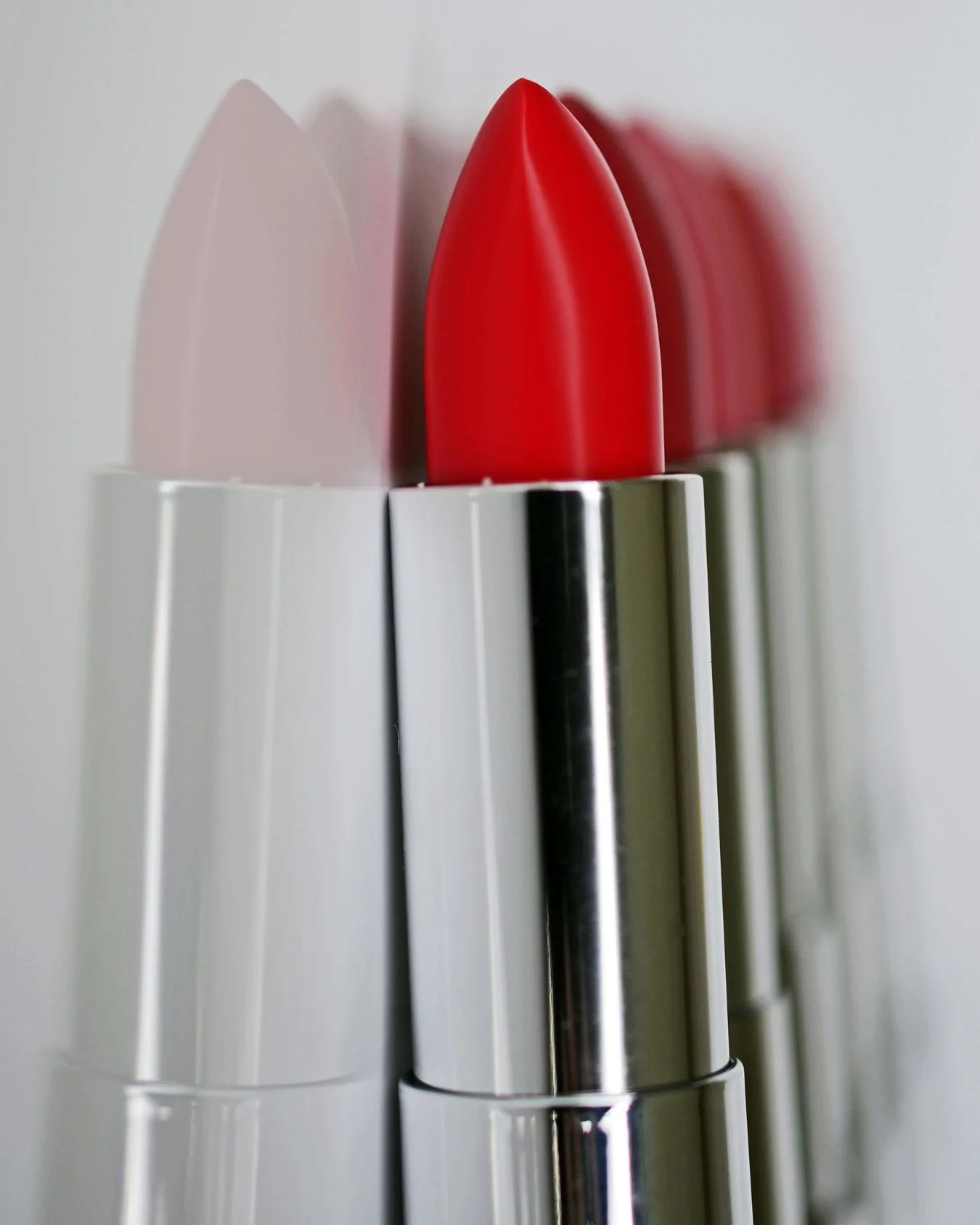 A red lipstick in a silver bullet.