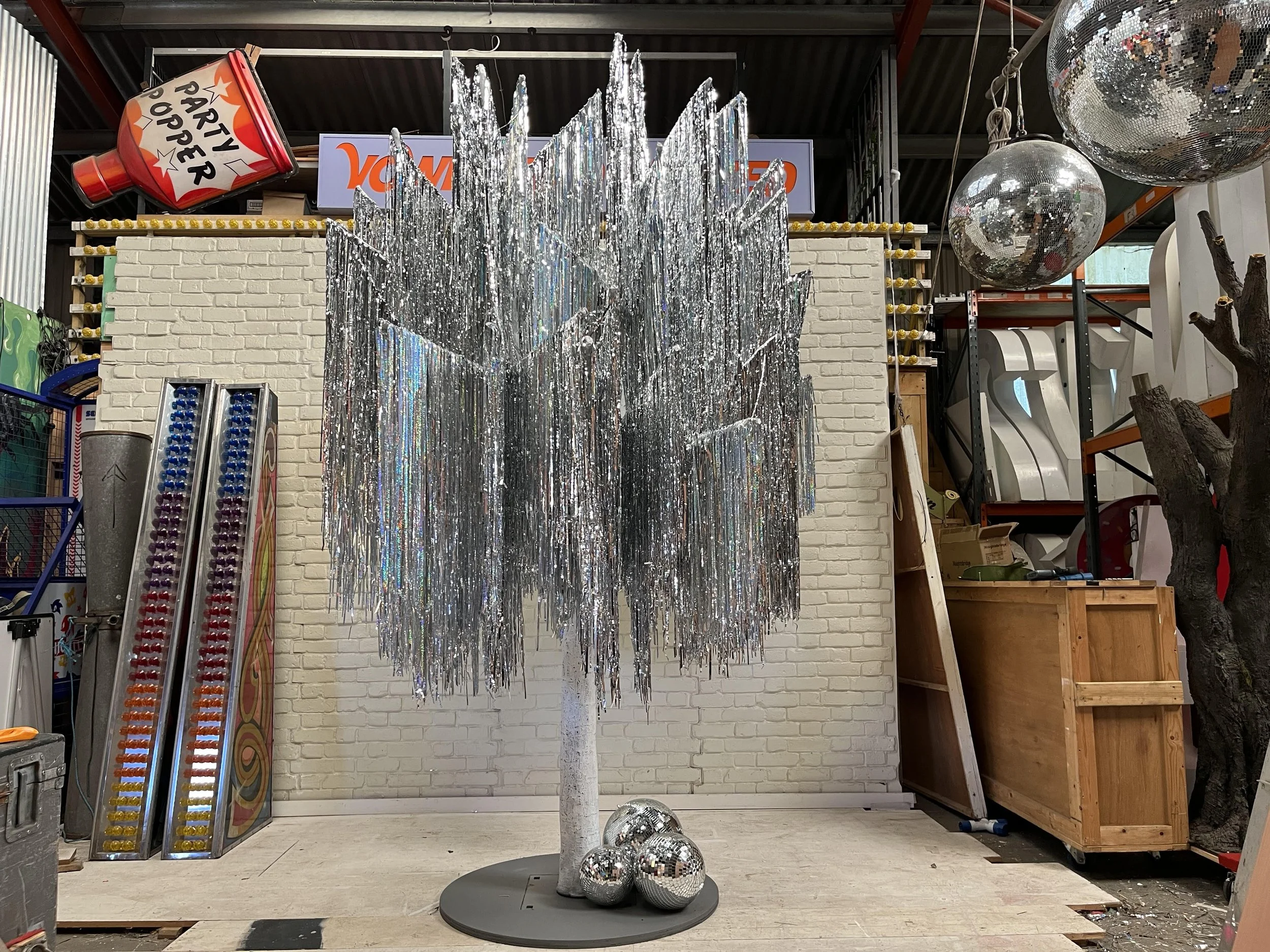 Vowed and Amazed Silver Tinsel Tree, perfect for weddings and late-night celebrations.