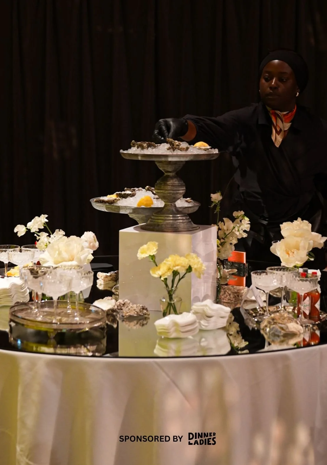 A stylish oyster bar set up for an engagement party that's catered by Dinner ladies. 