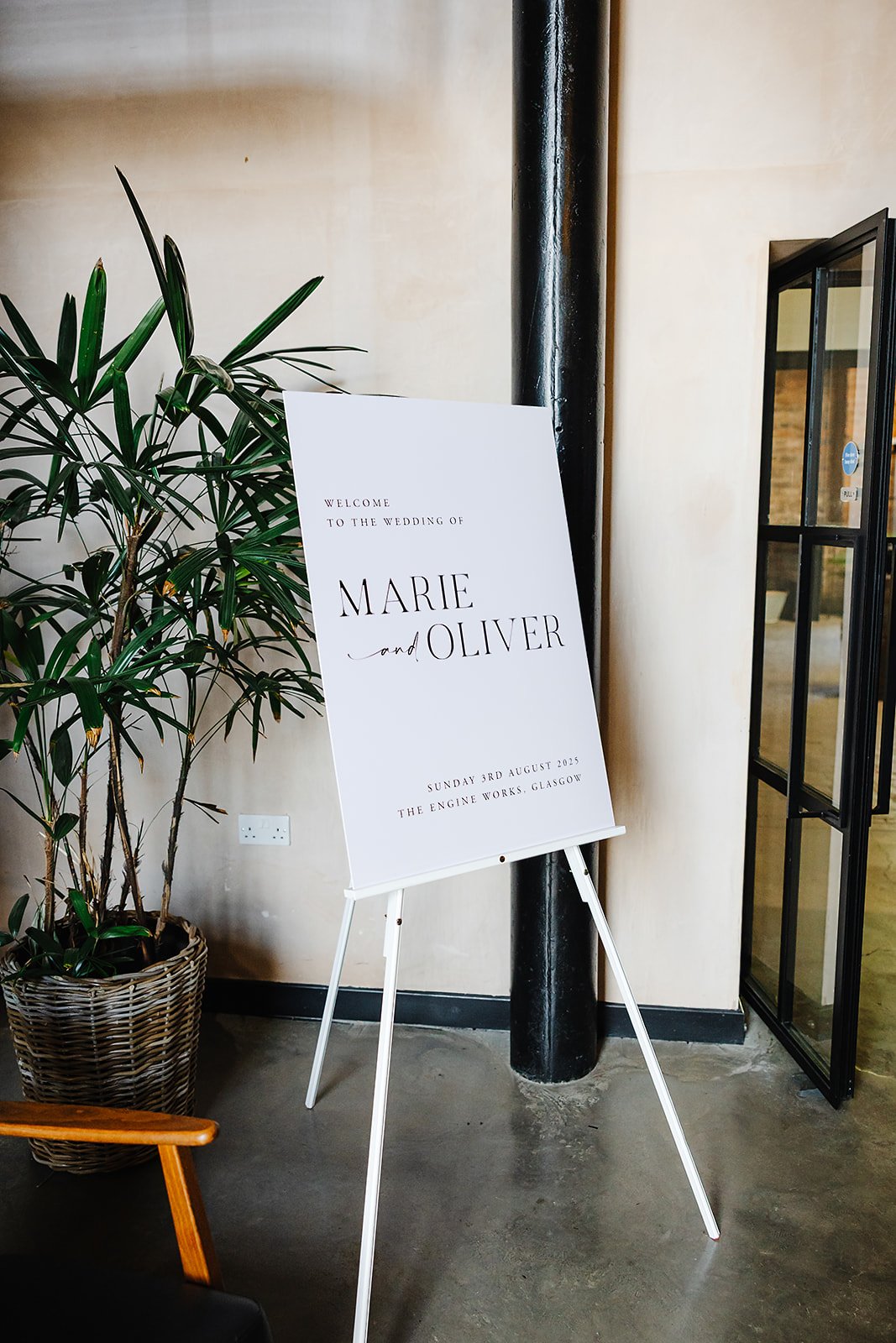 A sign saying 'Welcome to the Wedding of Marie and Oliver'.