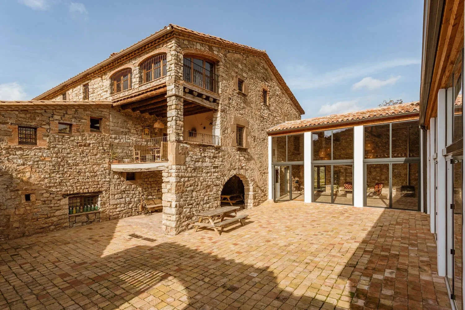 A sunny photograph of popular destination wedding venue 'This Must Be The Place' located in the Spanish Hills of Bacelona.