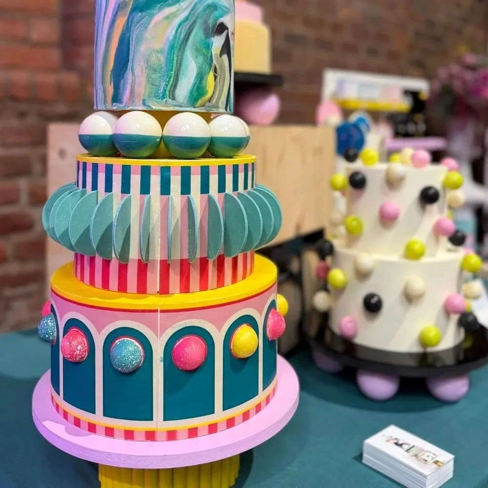 A unique and colourful wedding cake at a wedding fair.