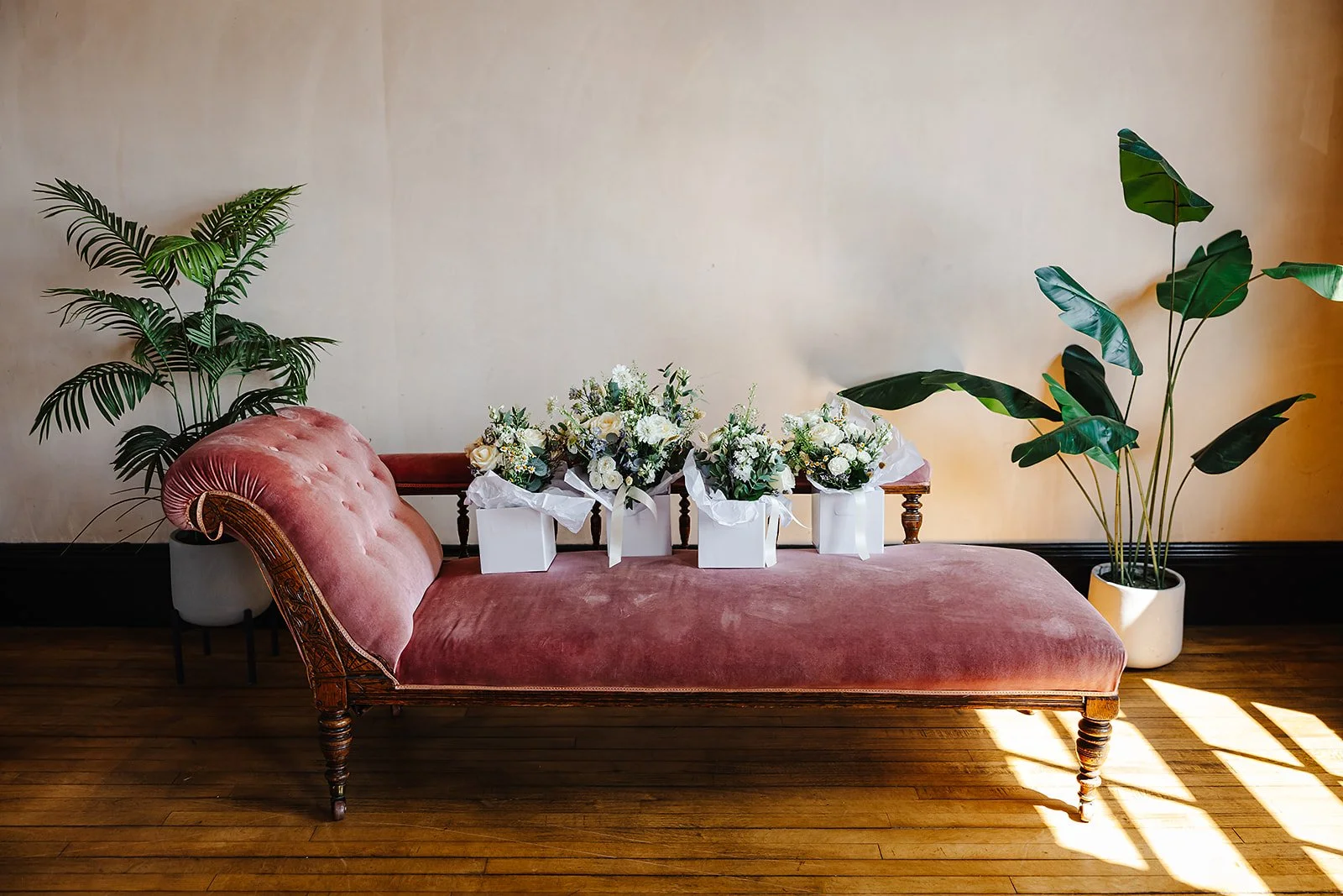 Four wedding bouquets on a Chaise Longue.