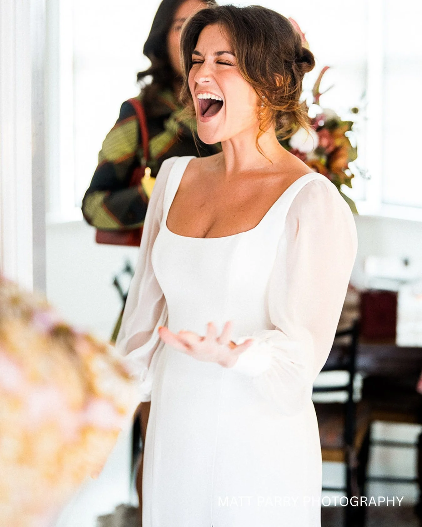 A bride has been captured by Matt Parry on the morning of her wedding. She looks so excited.
