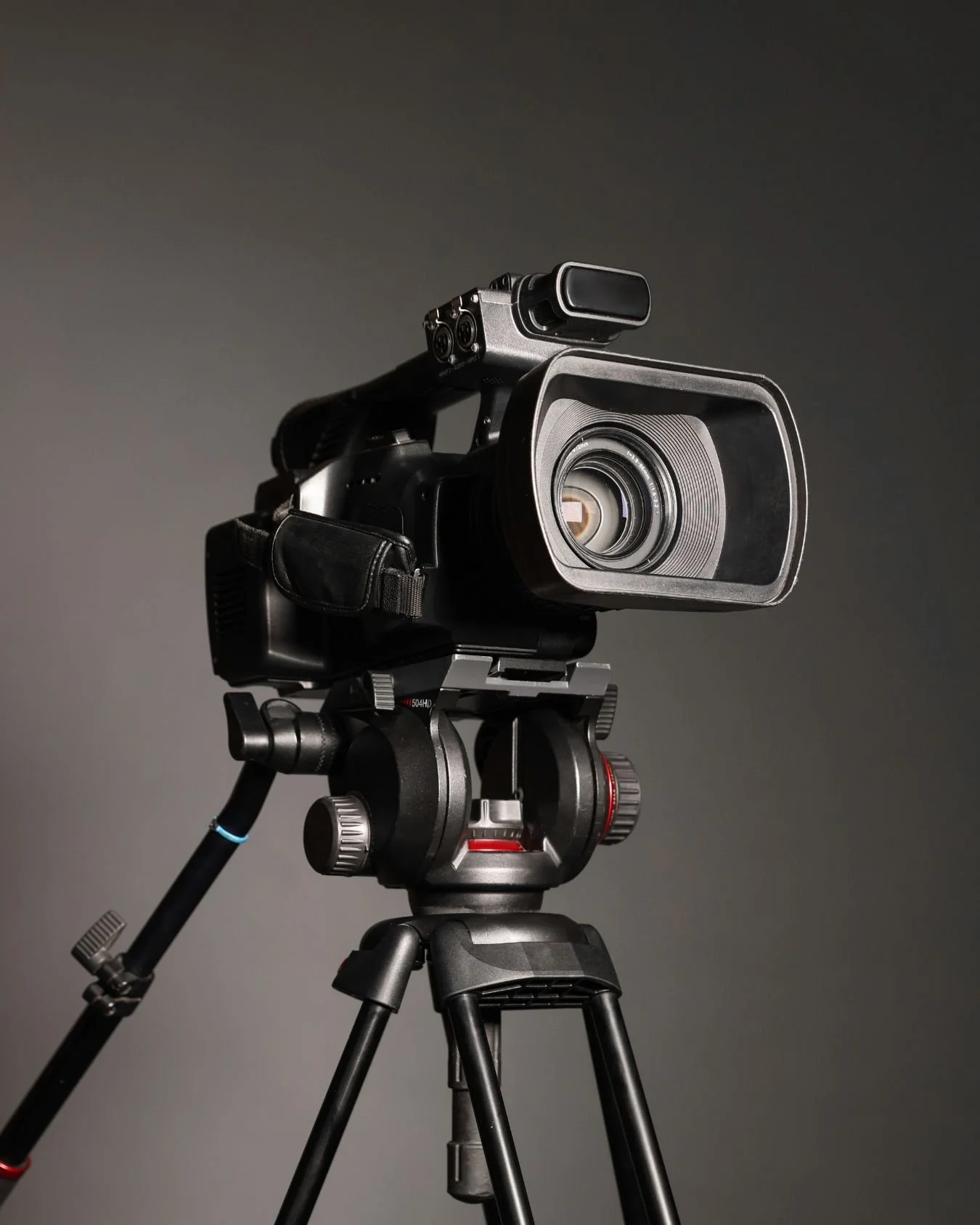 A black video camera for making wedding videos.