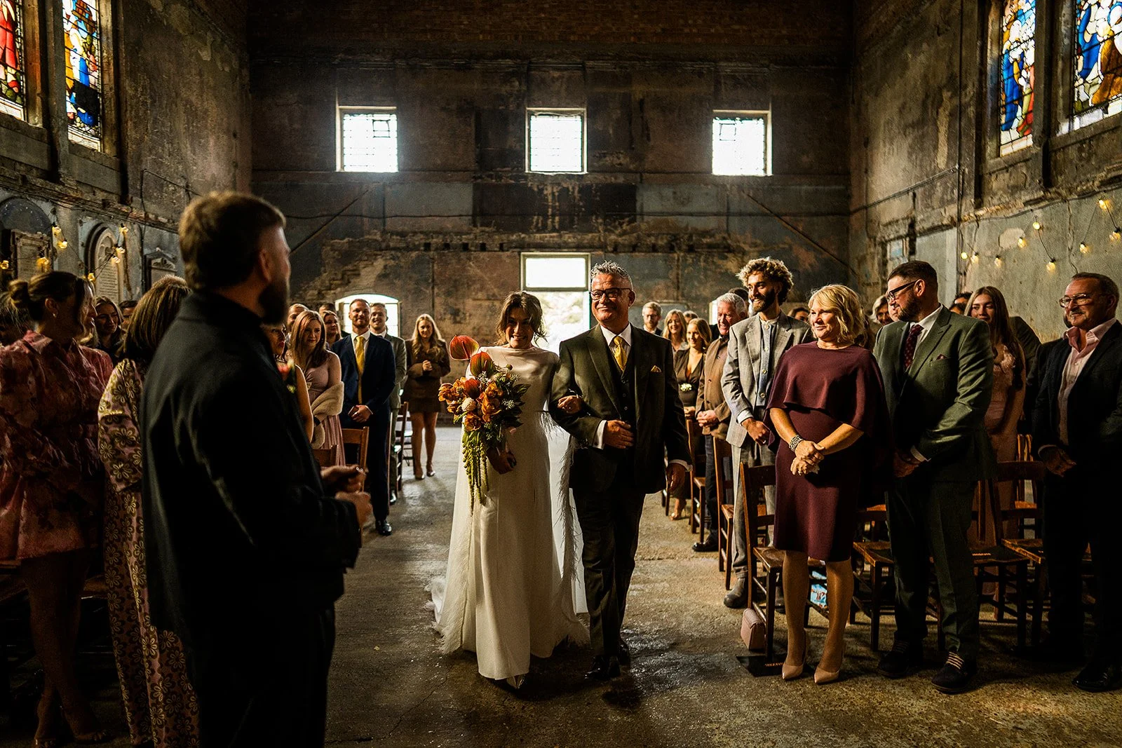 A father walking his daughter down the aisle on her wedding day.