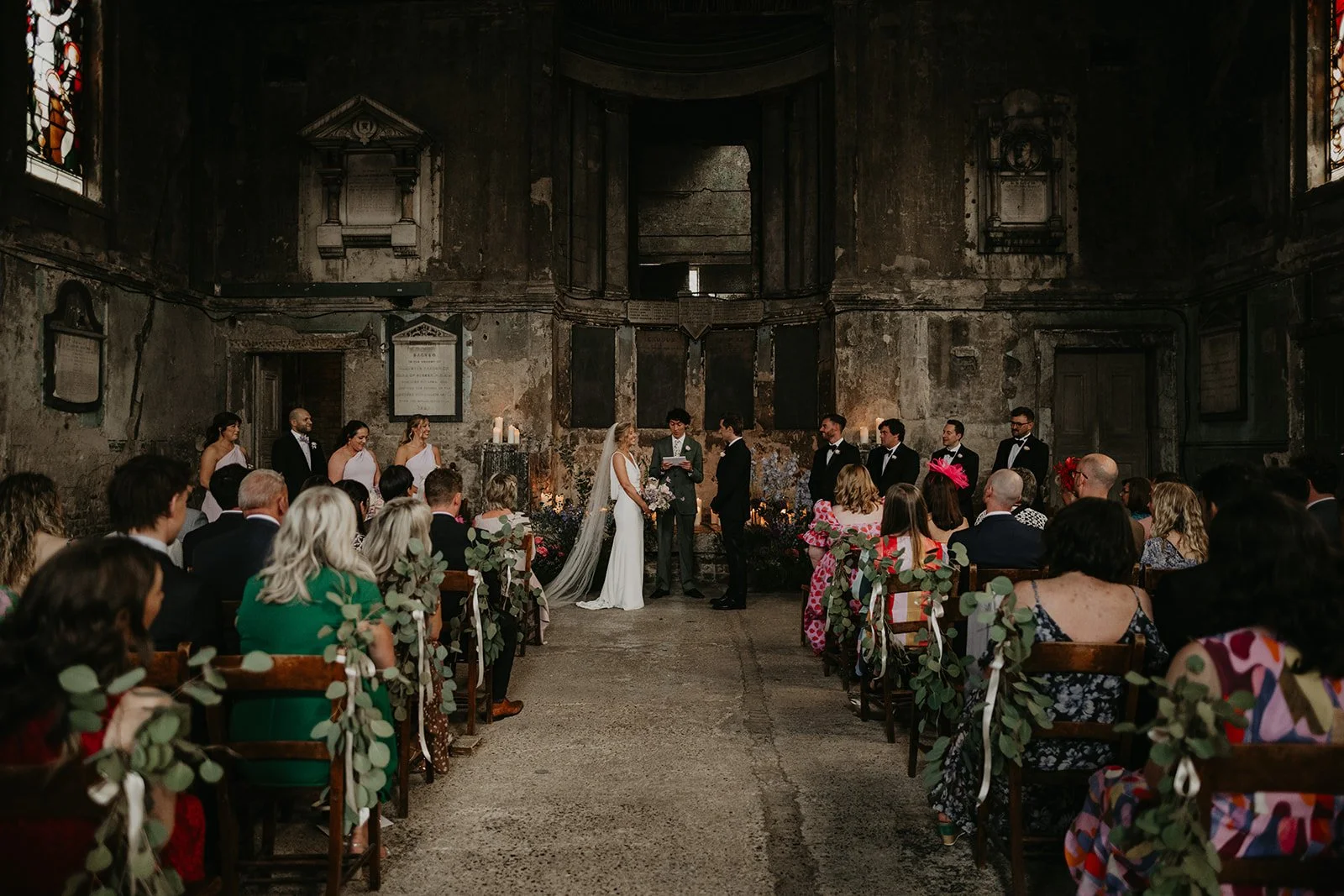 A wedding ceremony with a couple exchanging vows. Mark Horton Photography