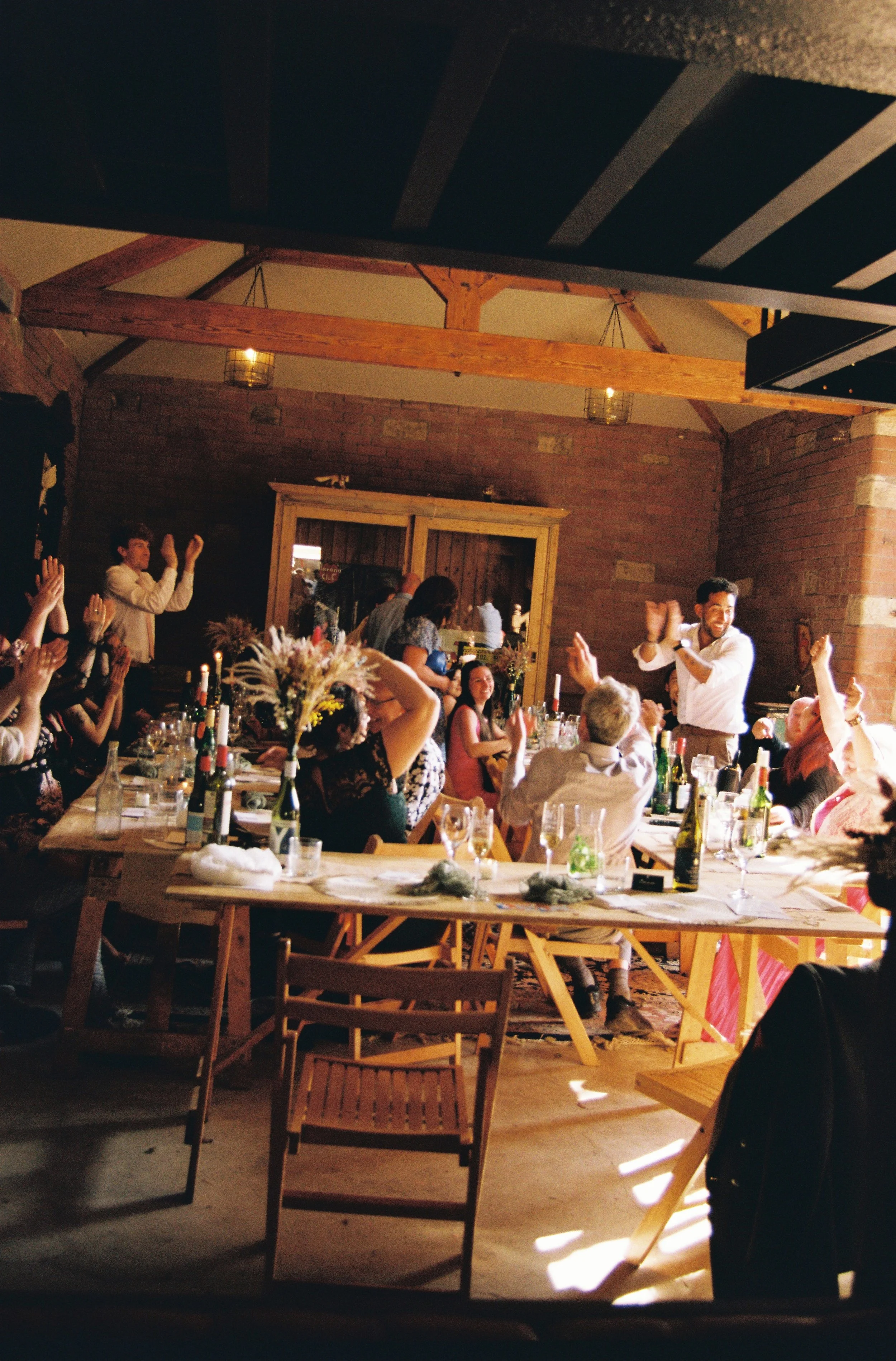 Elizabeth Royse Photography captures weddings with a raw documentary sensibility that blends irreverent humor intimate imperfection and cinematic grit shown through moments like a bride hiking up her dress on a painted staircase a burning champagne b