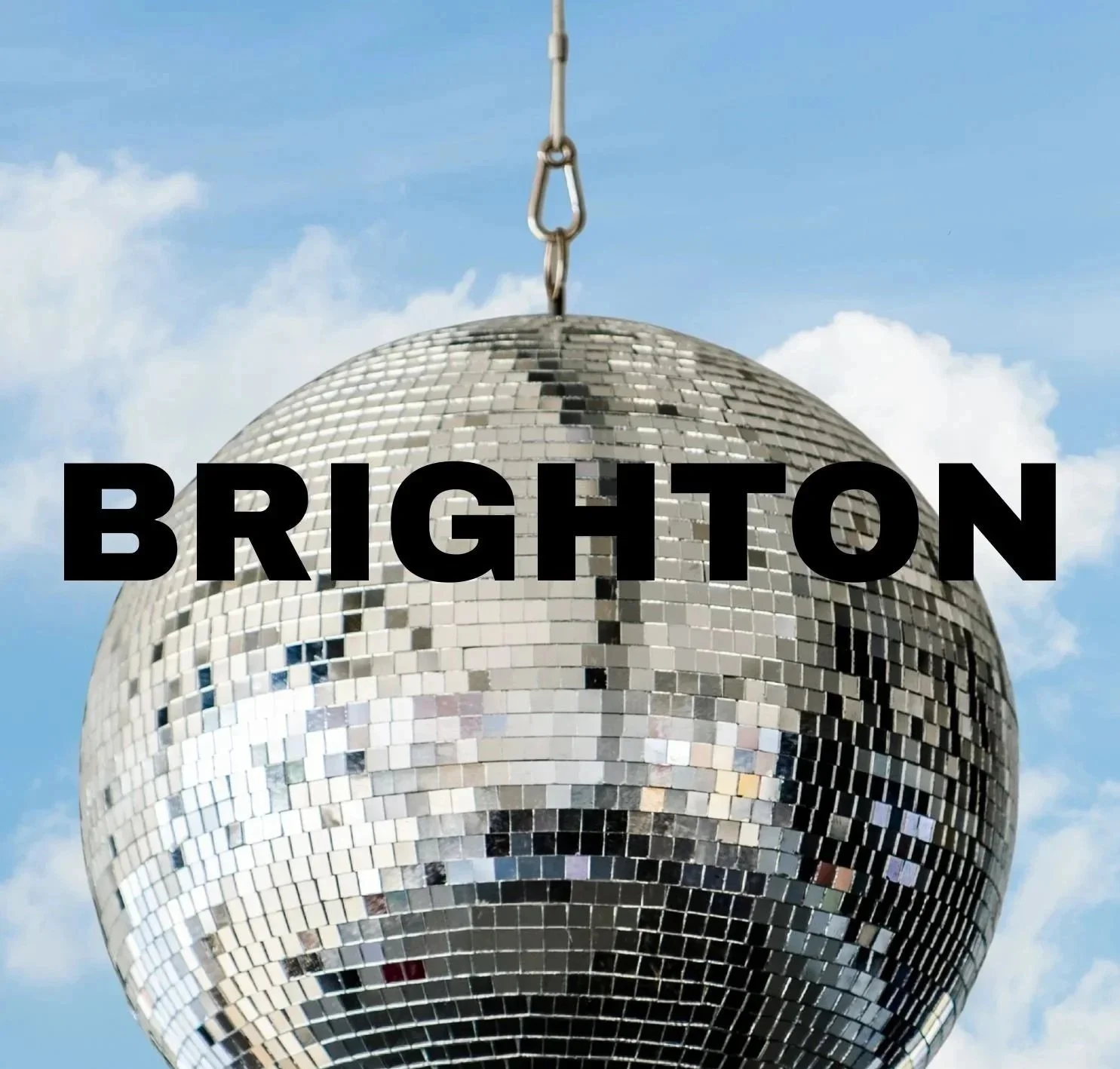 A disco ball on a cloudy sky background