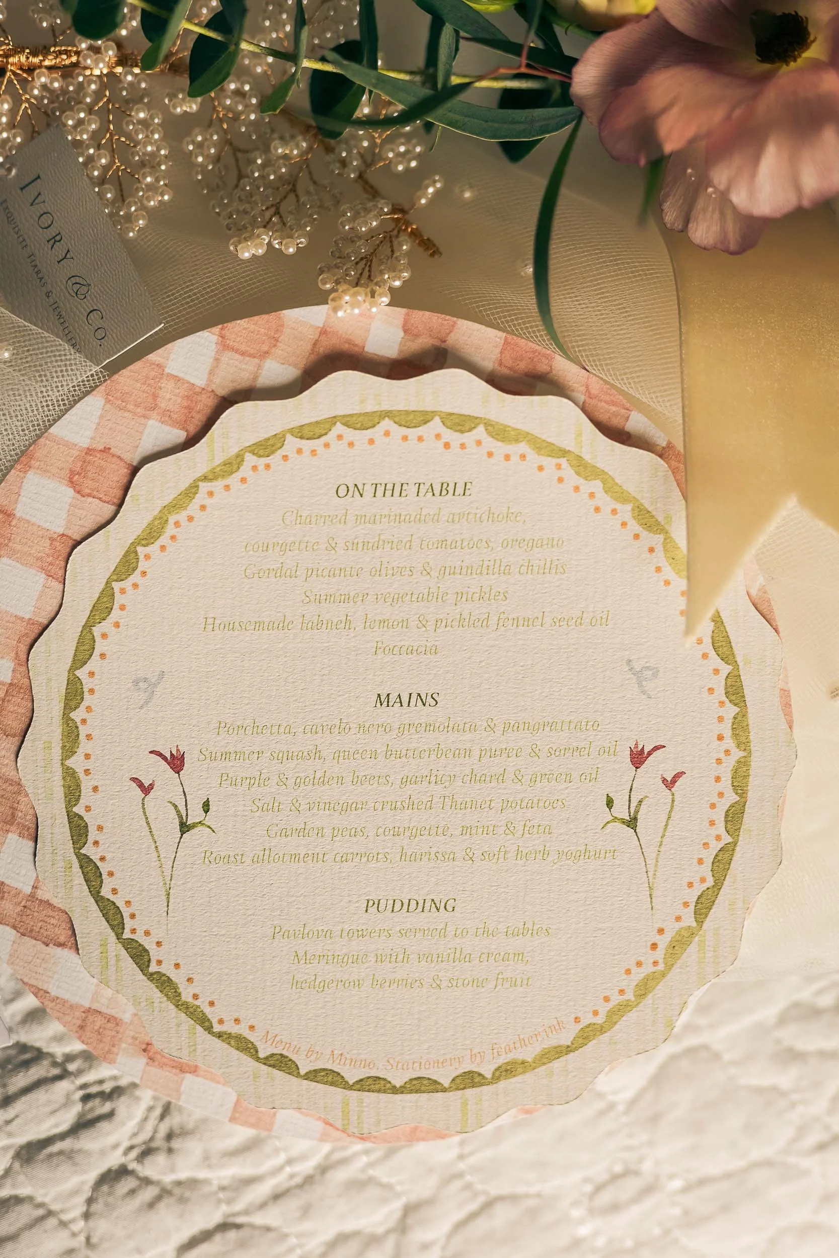 A pretty wedding menu with gingham details.