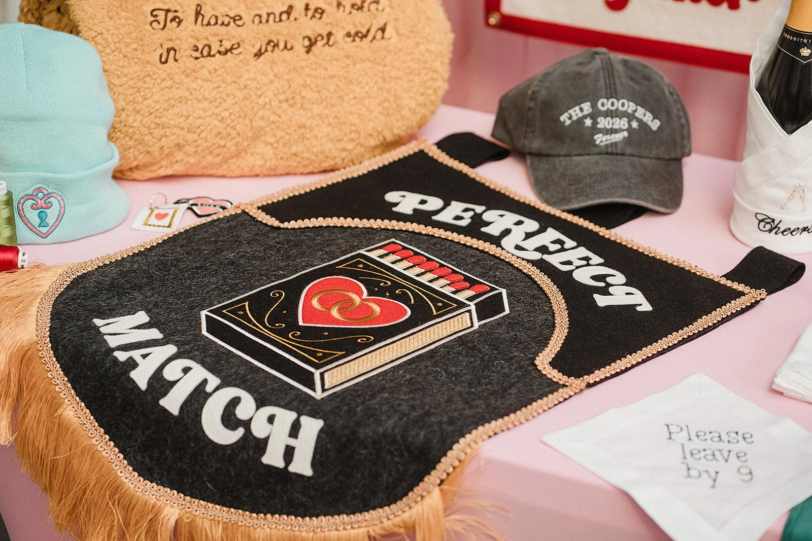 A fabric wedding banner on display at The Un-Wedding Show. Its black with the words PERFECT MATCH and a box of matches design with a red heart.