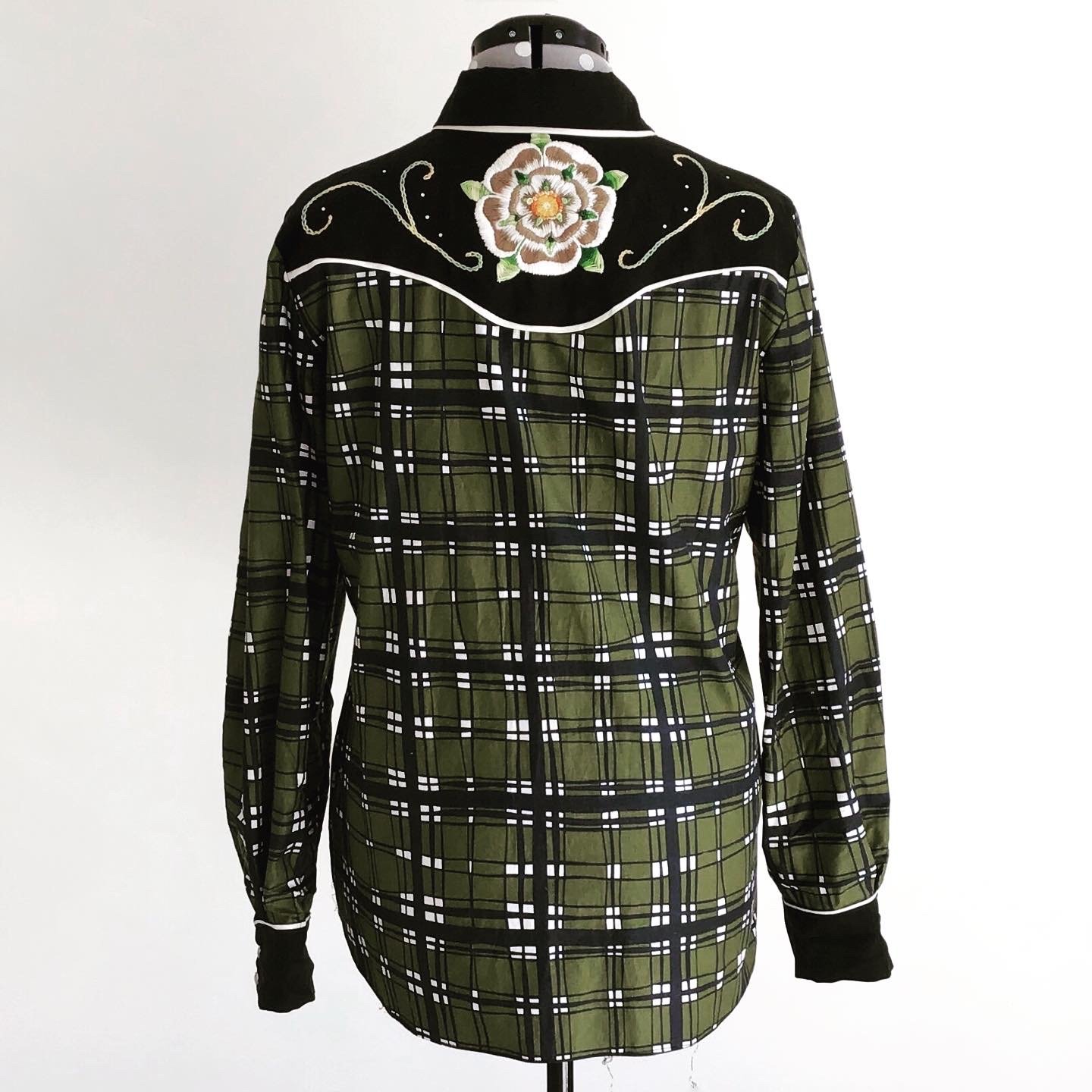 A western inspired shirt that has been hand embroidered.