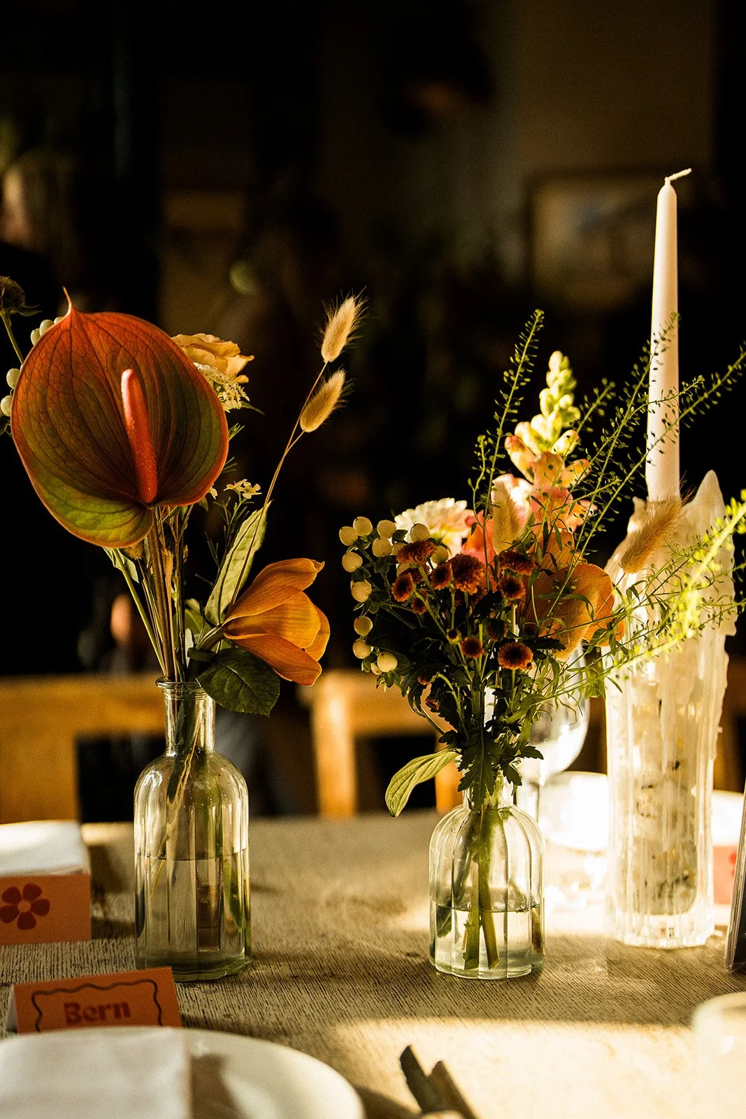 Table flower details at a modern wedding.