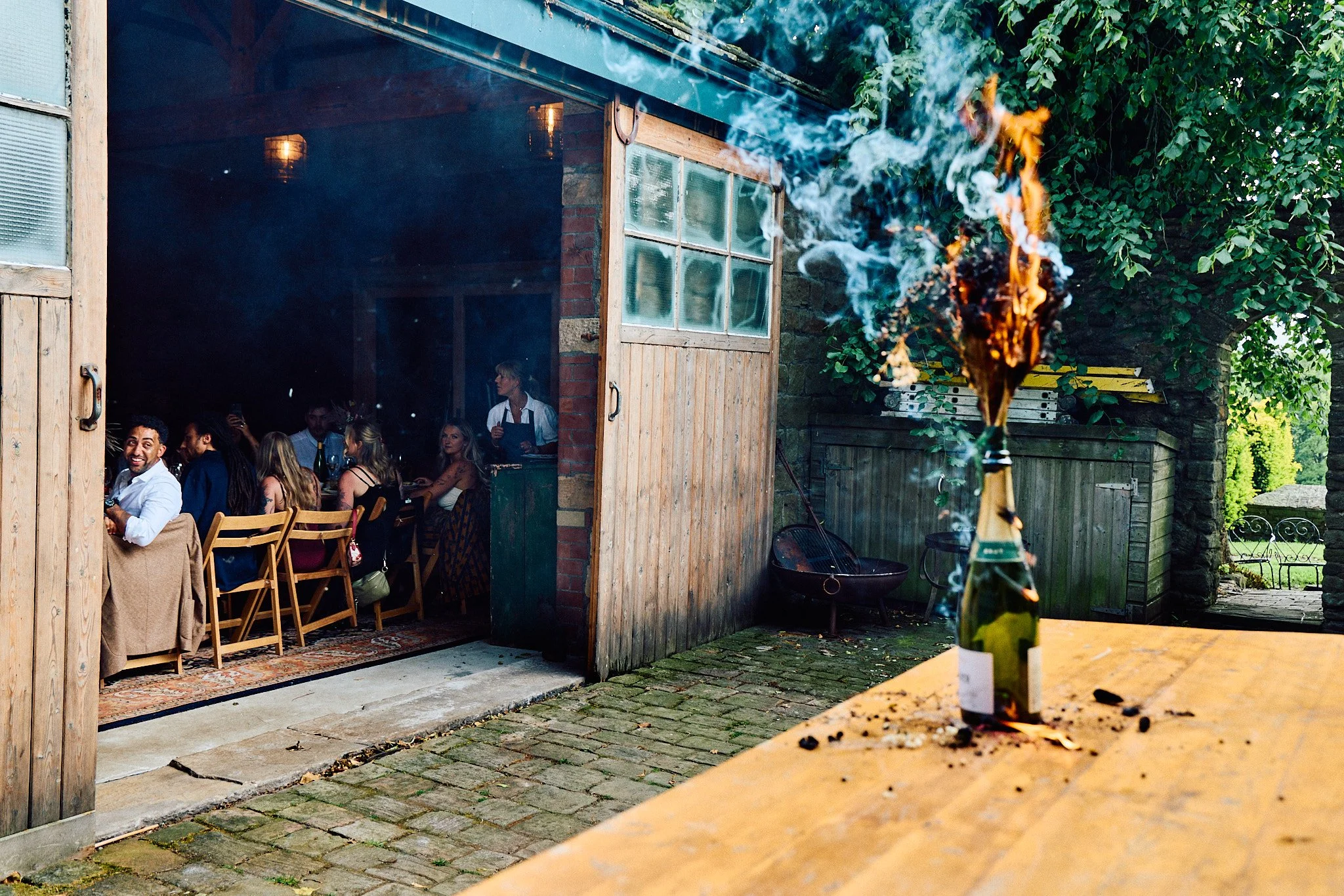 Elizabeth Royse Photography captures weddings with a bold documentary style that blends raw emotion with cinematic flair shown through unposed moments like a bride crouching in the grass to greet a horse moody flash lit portraits on grand staircases 