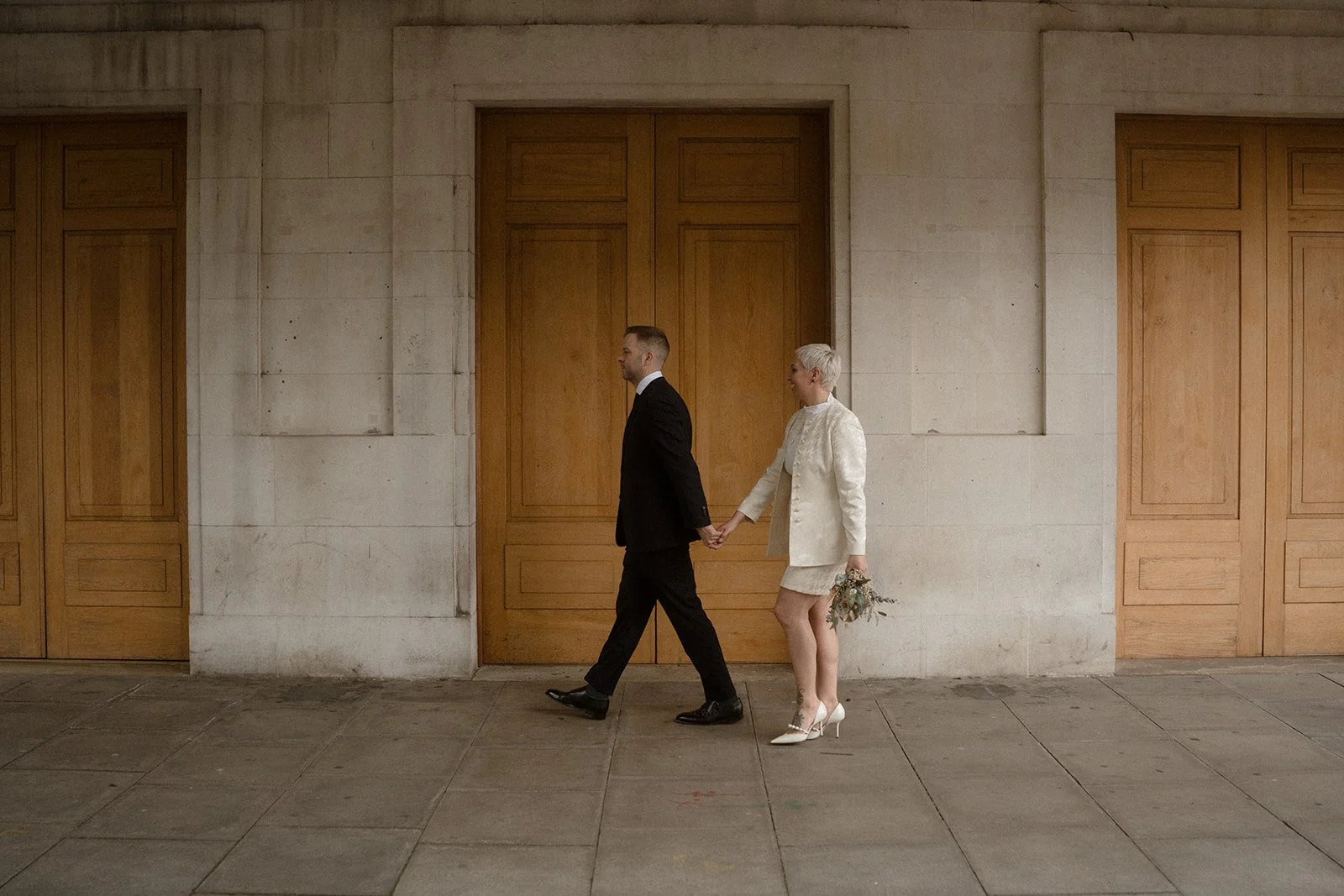 Rose and Joe holding hands.