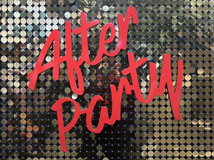 Vowed and Amazed bold red 'After Party' sign displayed on a shimmering sequin backdrop, perfect for weddings and late-night celebrations.