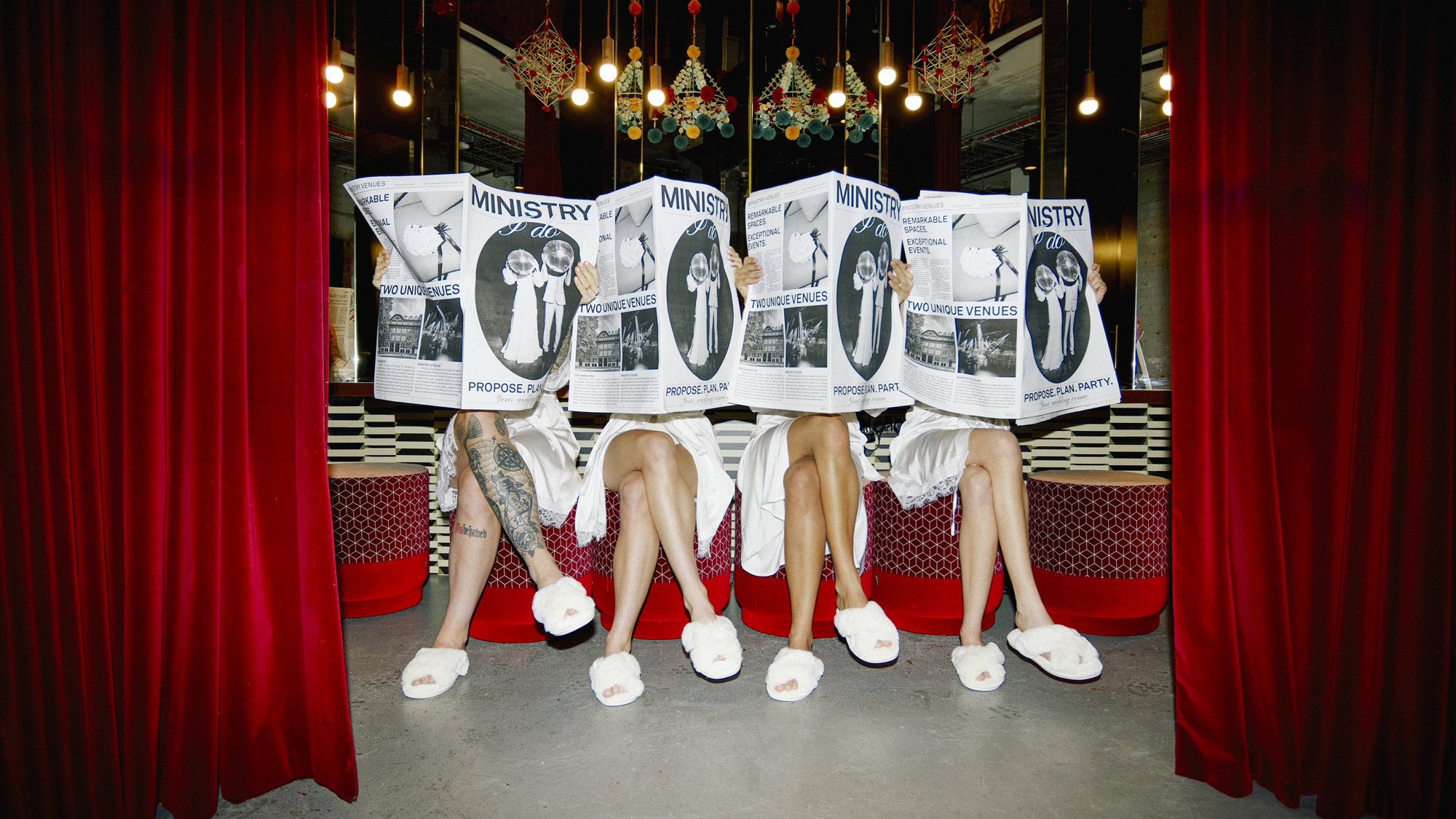 Contemporary wedding morning scene at Ministry 'I Do' Wedding Venues, featuring a playful bridal party moment with relaxed styling, modern interiors and a vibrant, design-led celebration atmosphere.