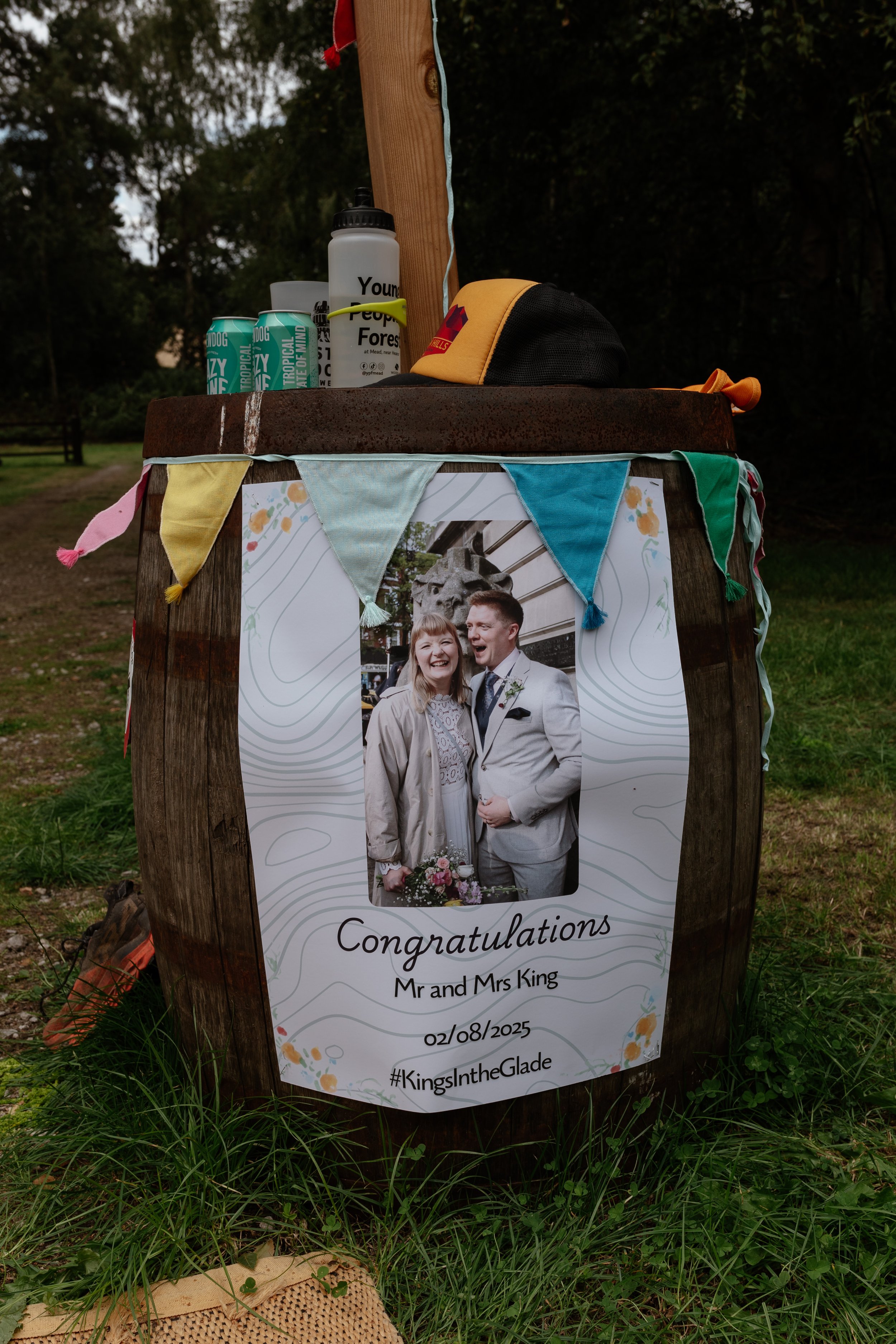 A poster of a bride and groom with colourful bunting arund it. The words say 'Congratulations Mr and Mrs King'