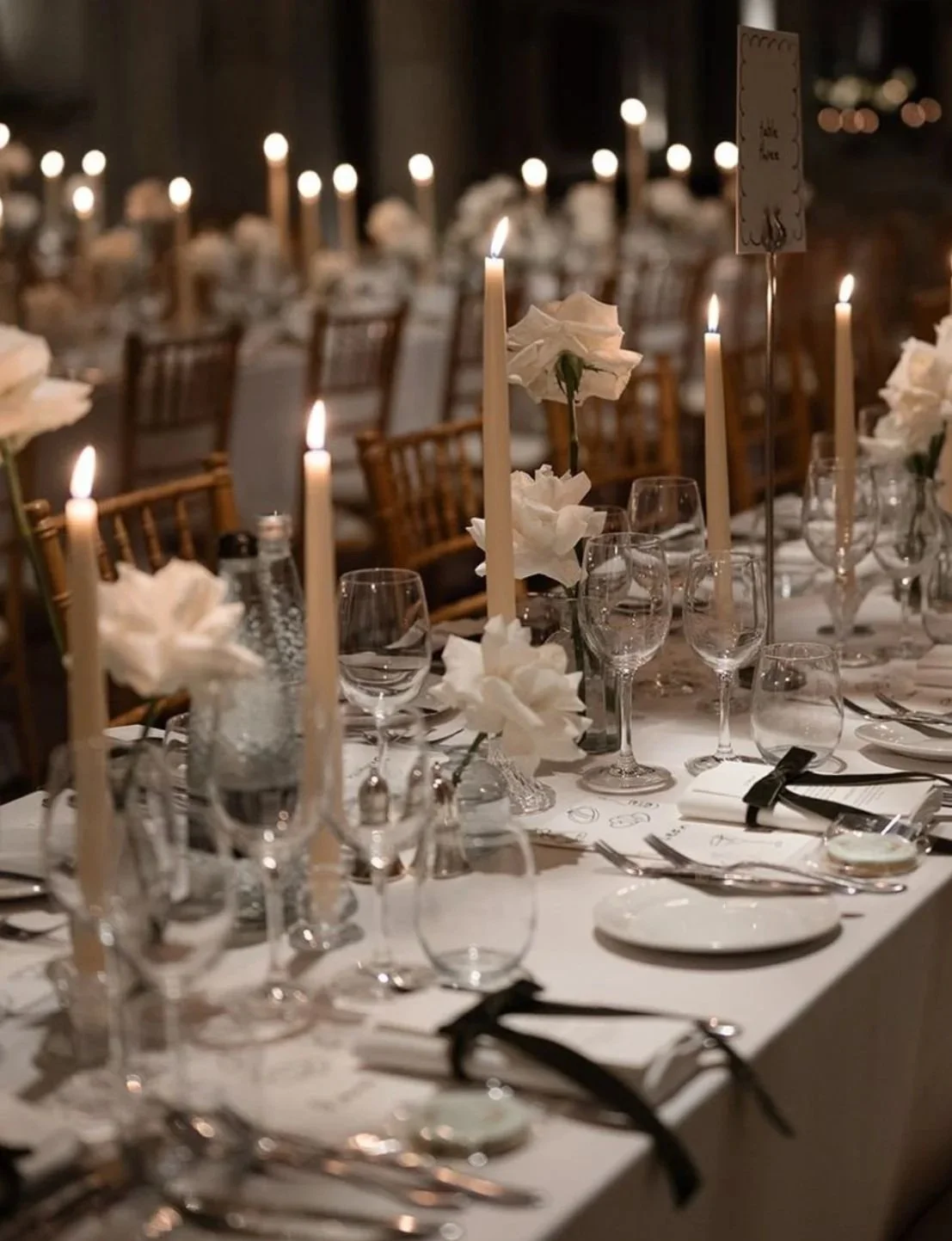A candlelit wedding table set up by Foil Events