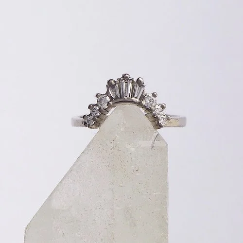 Stunning silver diamond crown-shaped wedding band by Daniel Darby Jewellery Designer. Handcrafted in the UK, this elegant design features baguette and round-cut diamonds, perfect for stacking with engagement rings.