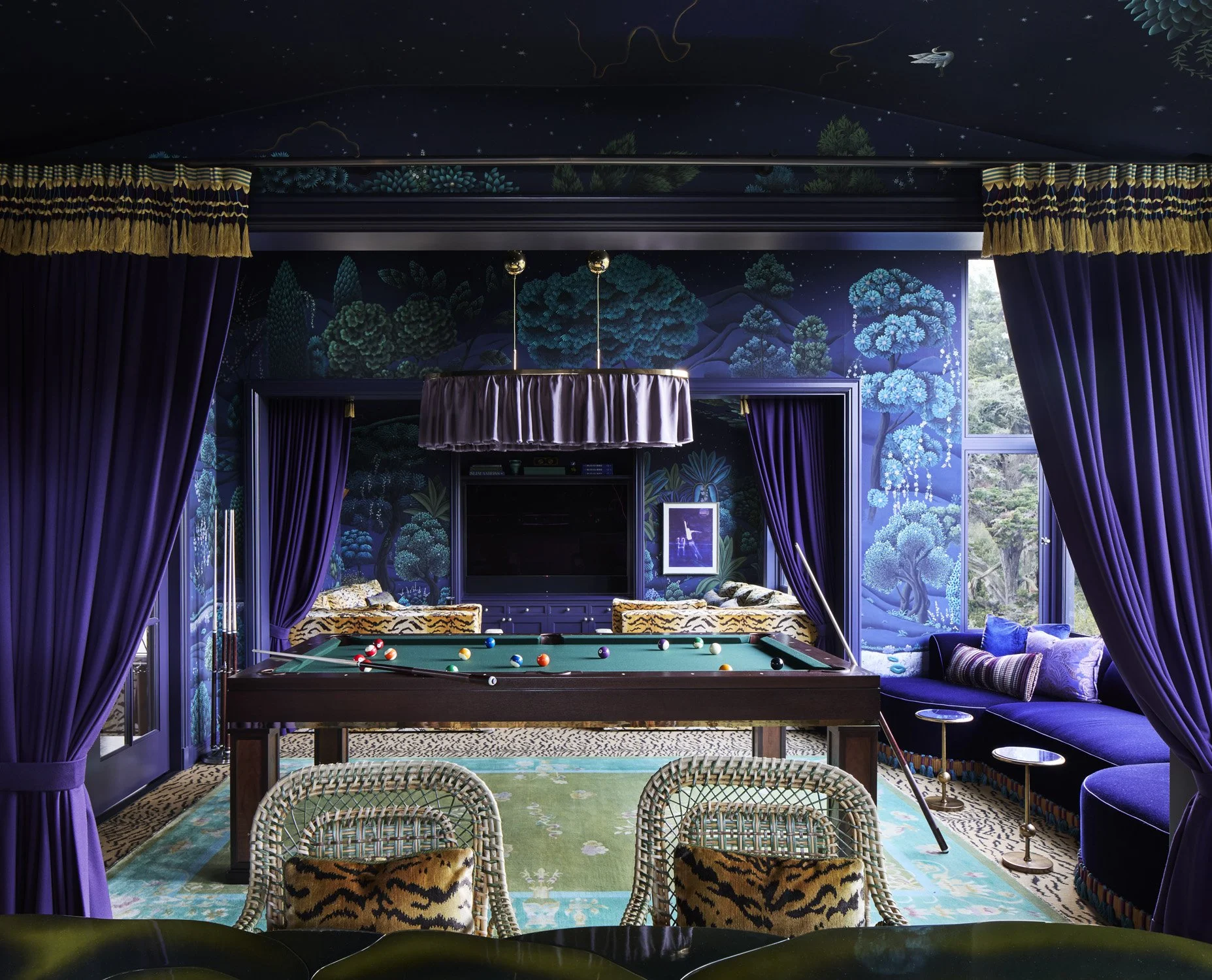Moody game room with billiards table, theater-like drapery and billiards table overlooking Presidio Park, San Francisco.