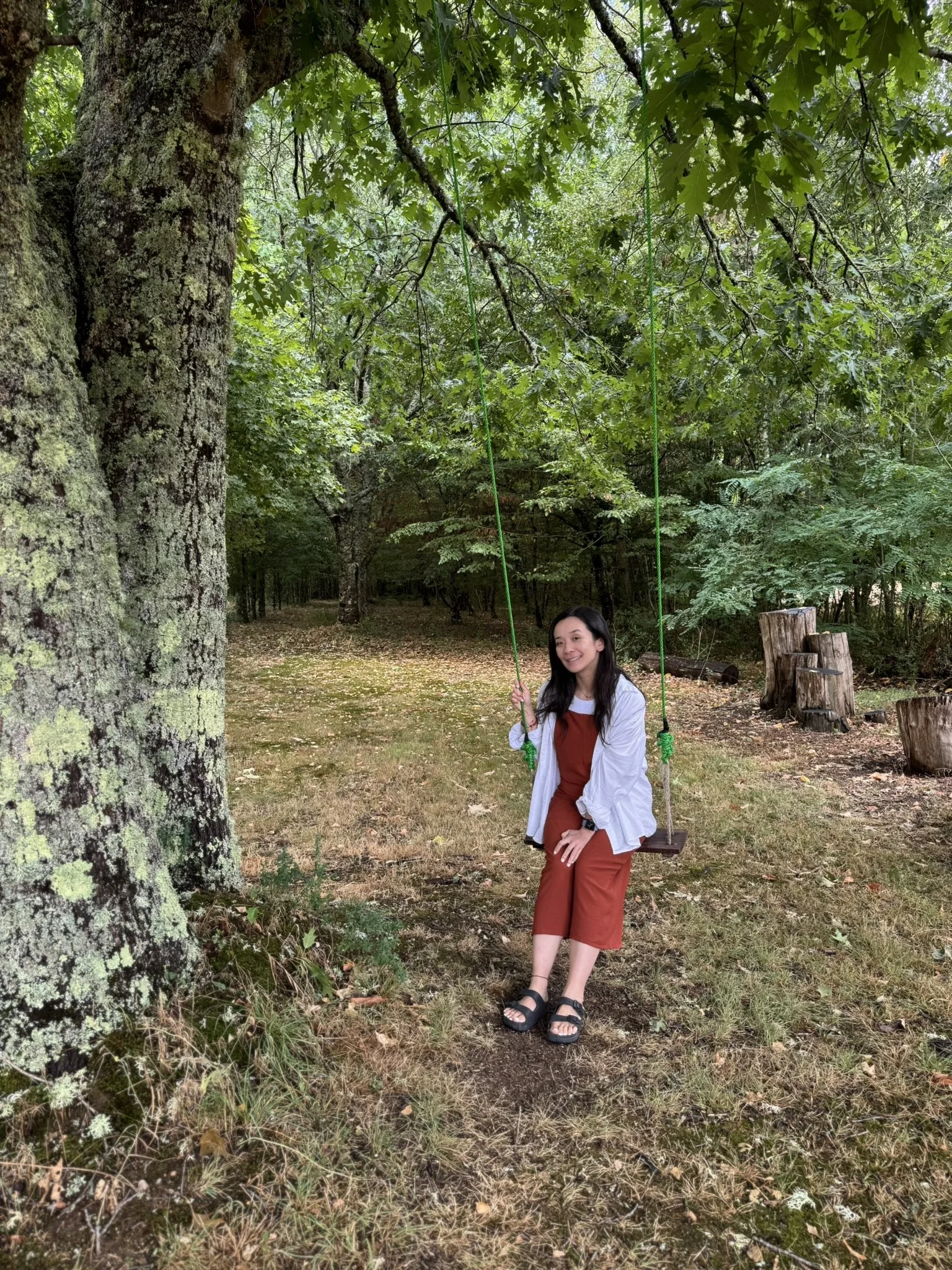 Li Lamb, hypnotherapist in Ilkley, Yorkshire, smiling outdoors in nature, promoting calm and emotional wellbeing.