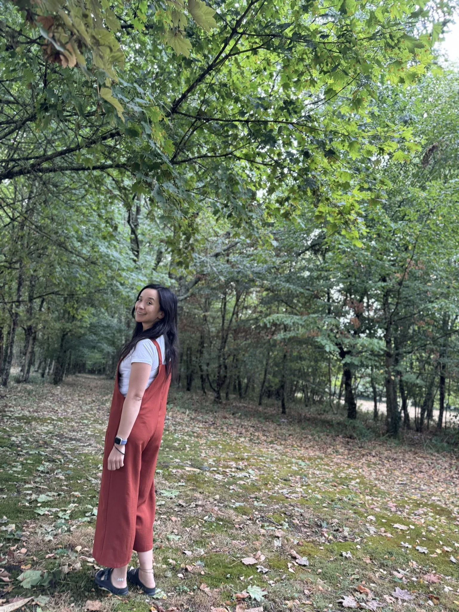 Hypnotherapist Li Lamb in Ilkley, Yorkshire, walking through nature, aligned with holistic mind transformation.