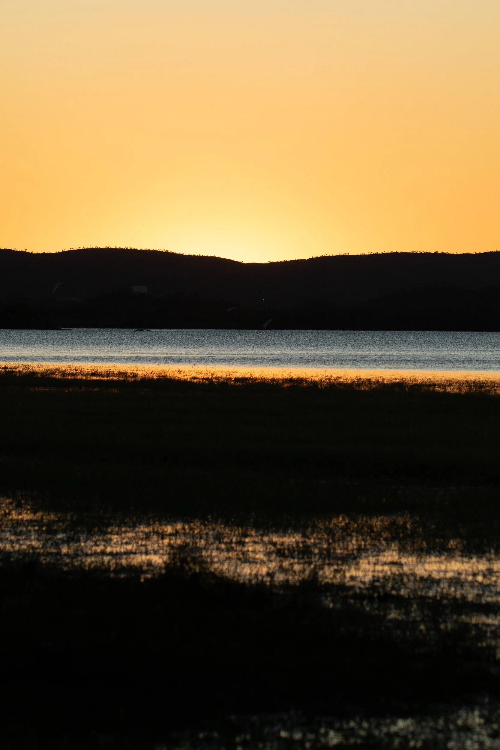 Sunset over the water.