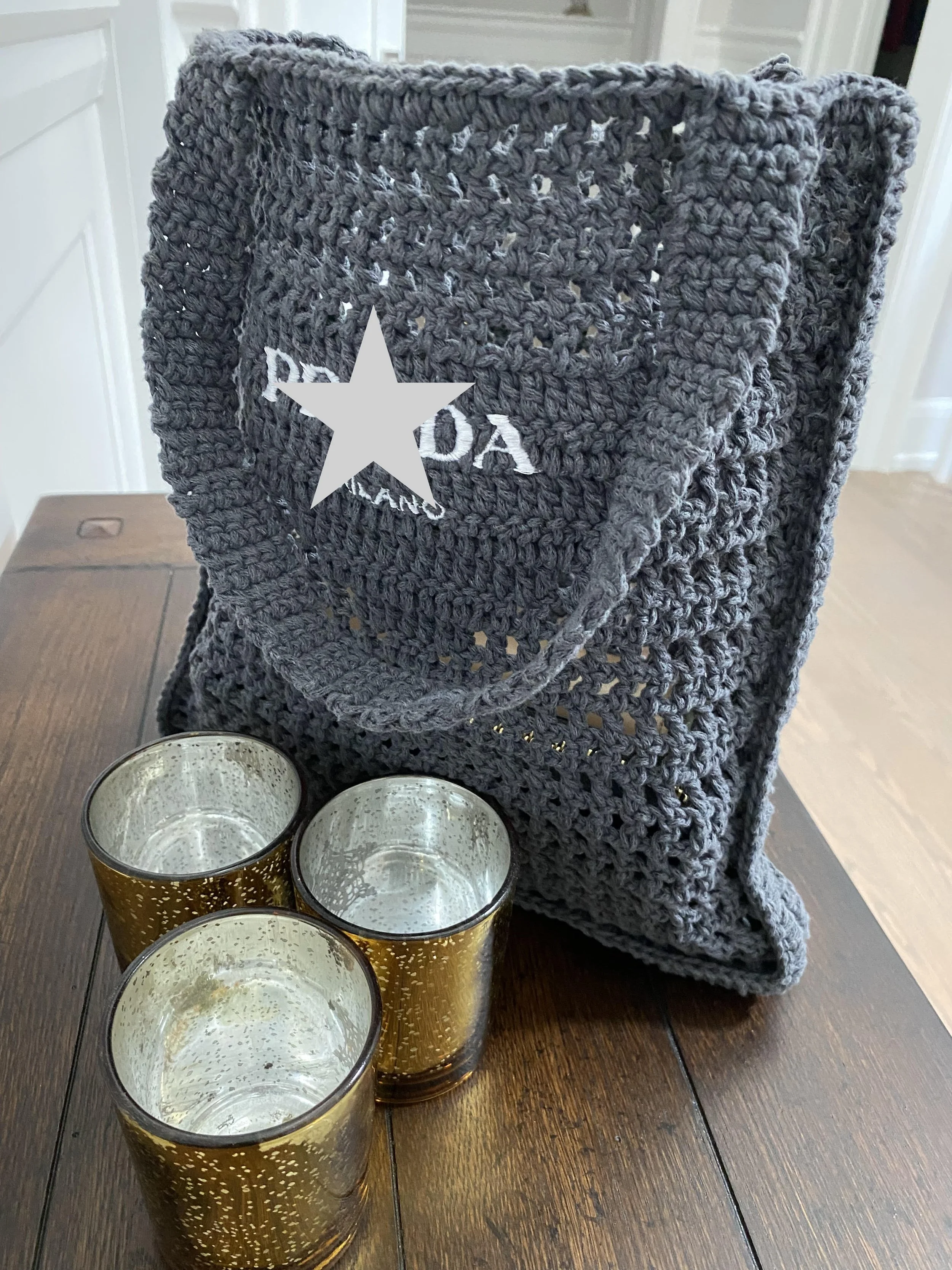 Grey sitting on table, with star cover.JPG