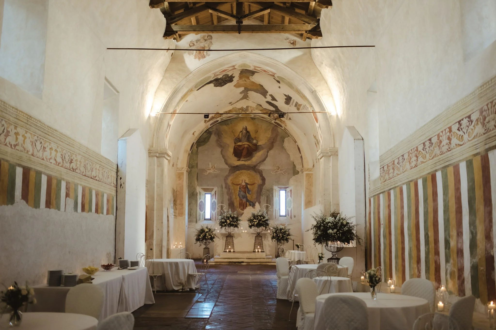 Historic wedding interior captured during an elegant wedding ceremony in Italy.