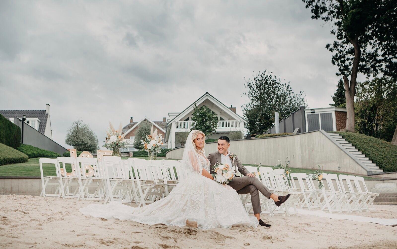 Seaside ceremony with bride and groom enjoying the view during destination wedding in the Netherlands