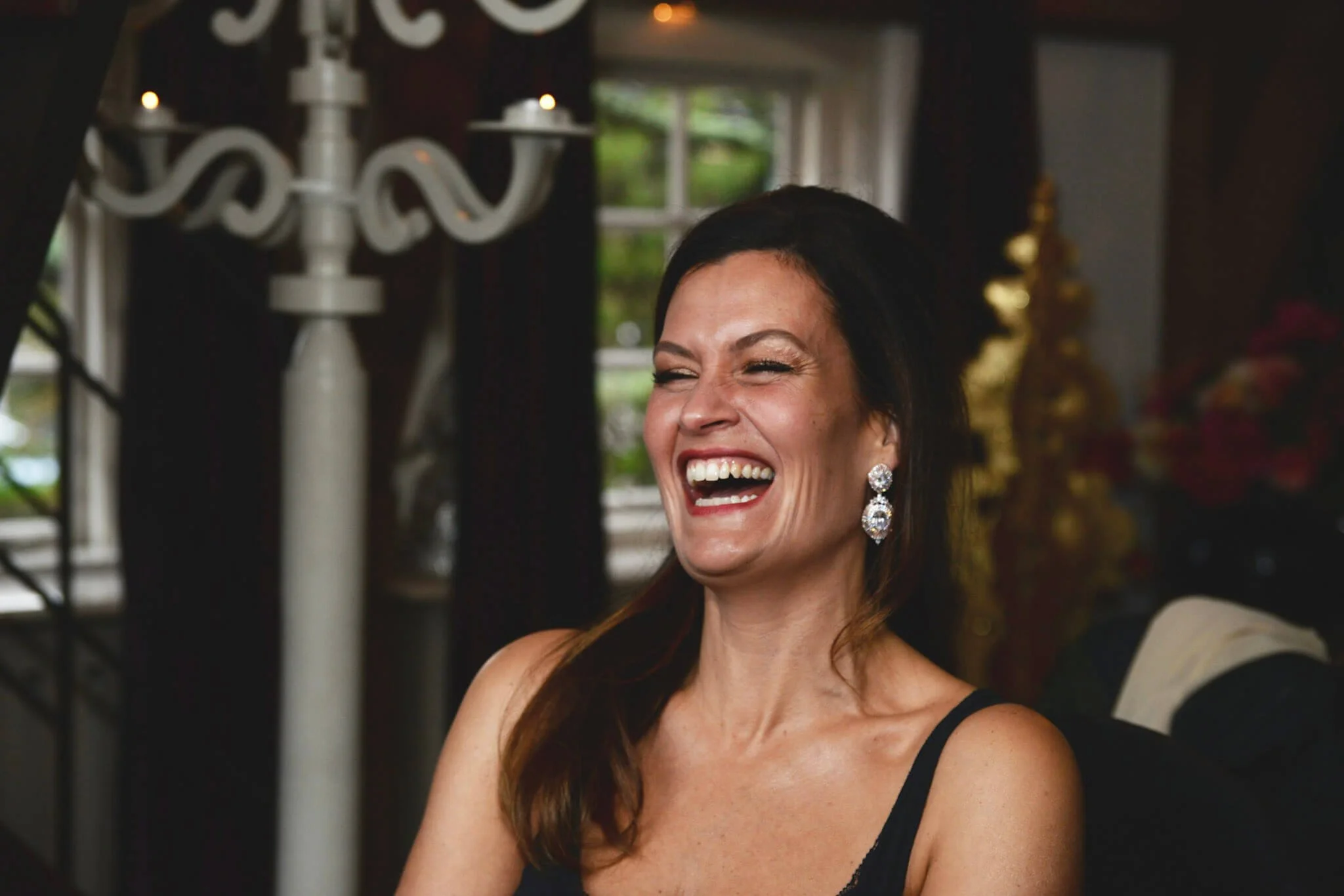 bride having a big smile during makeup session