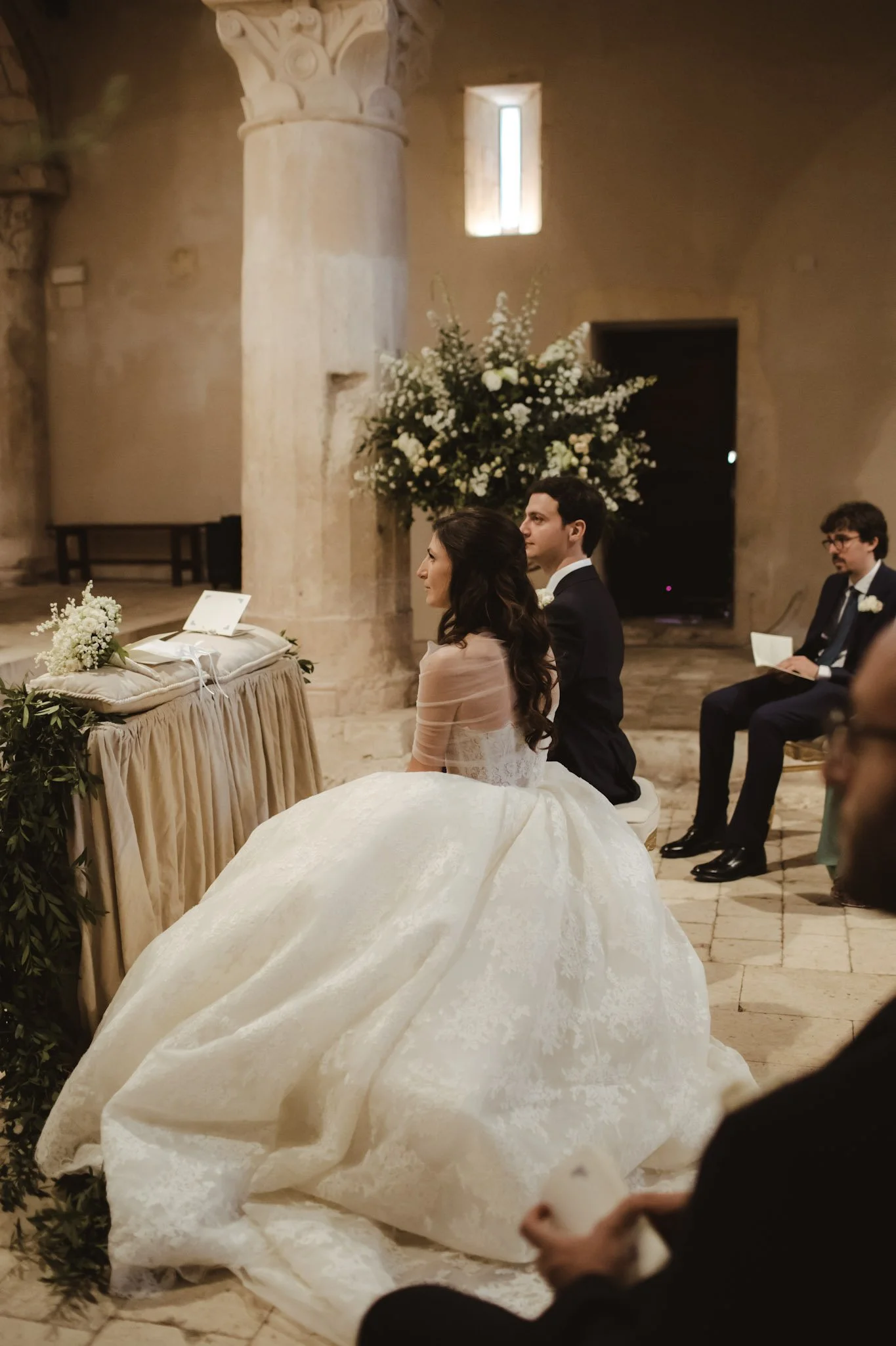 Bride and groom during their church ceremony at a luxury destination wedding in Italy.