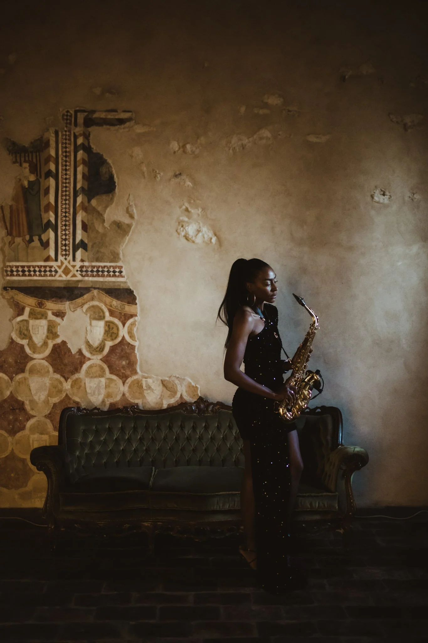 Female saxophonist performing at a luxury destination wedding in Italy.