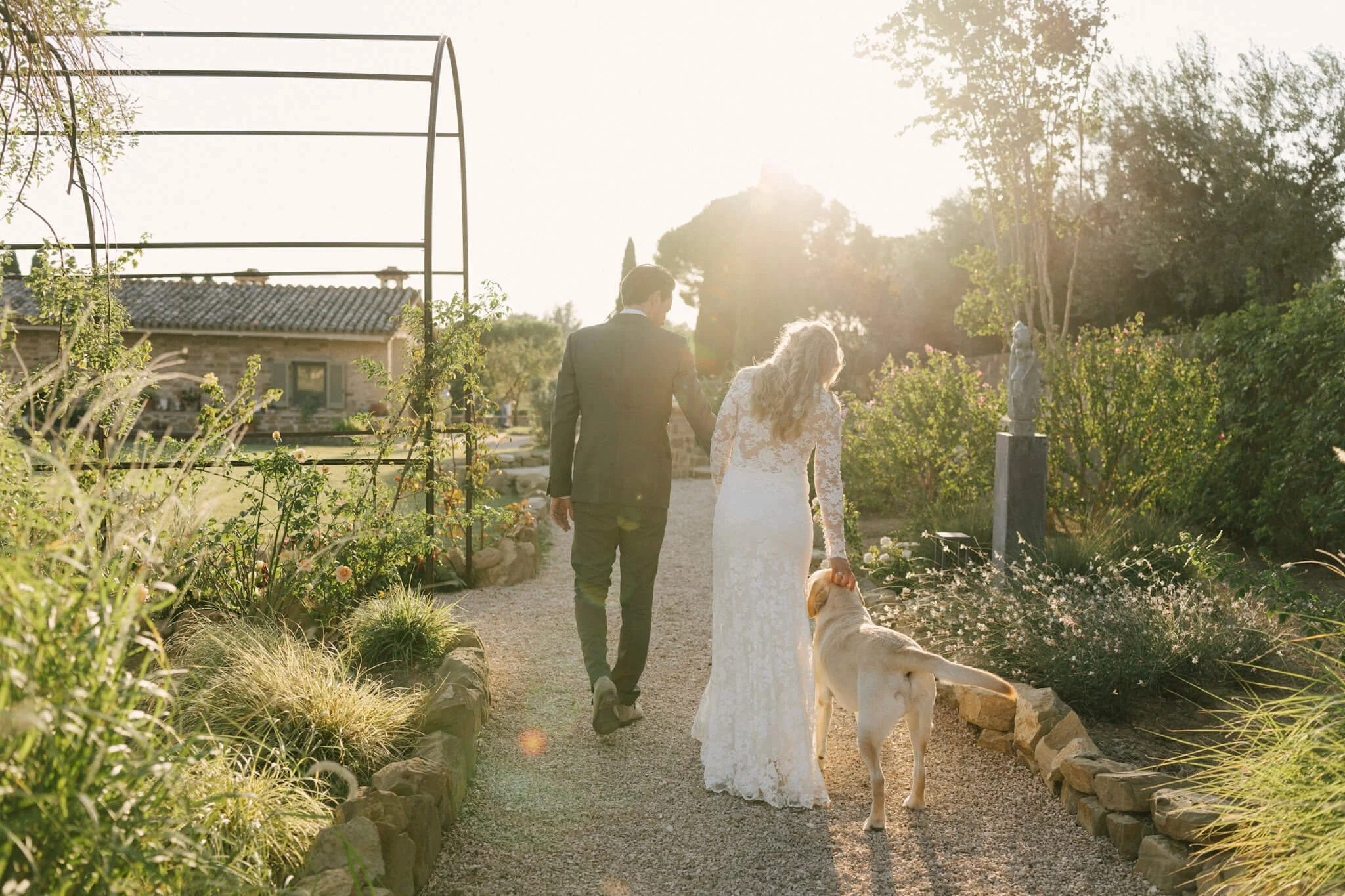 Bride and groom with their beloved dog during their Italian wedding in Assisi.