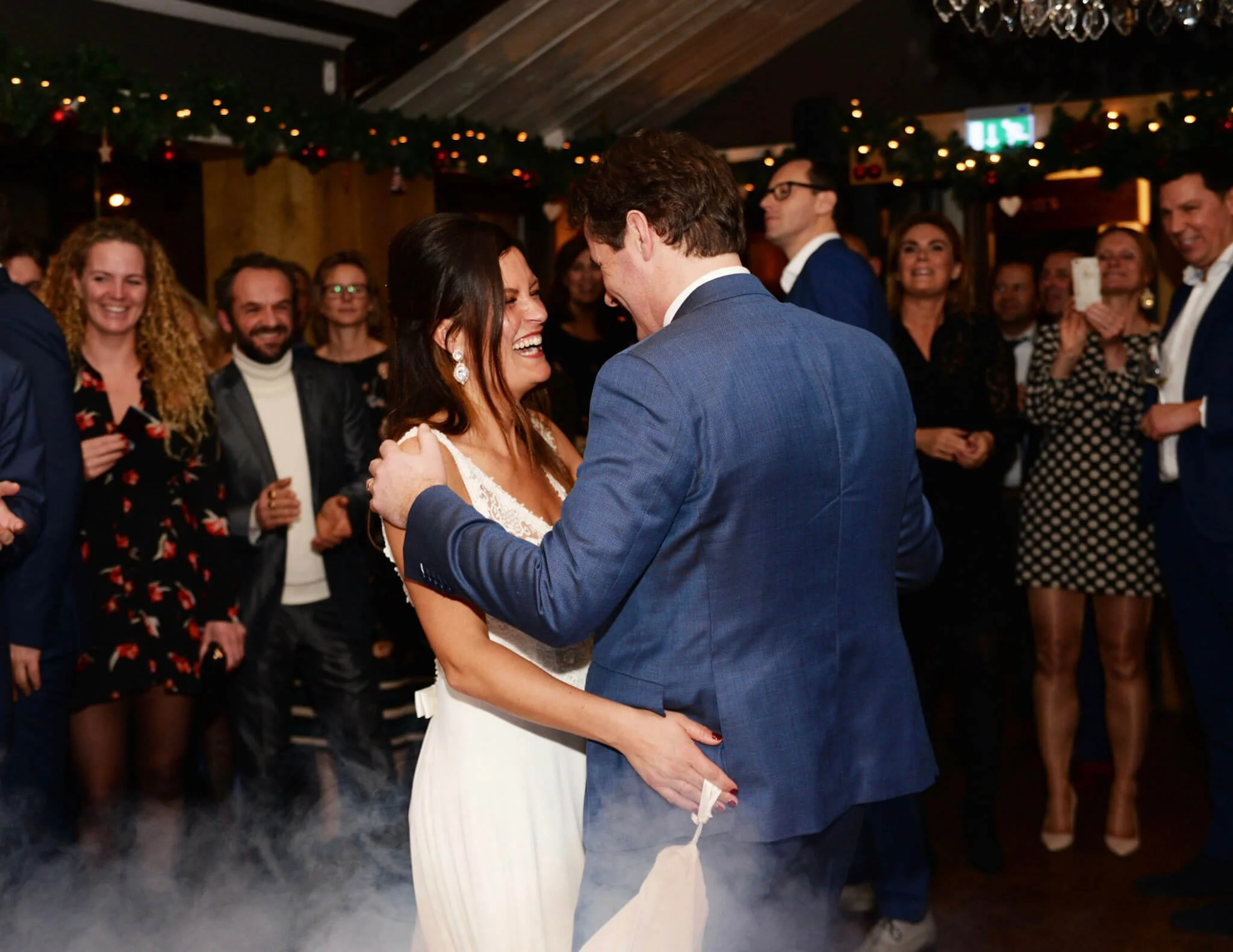 Bride and groom dancing together at their winter wedding in The Hague