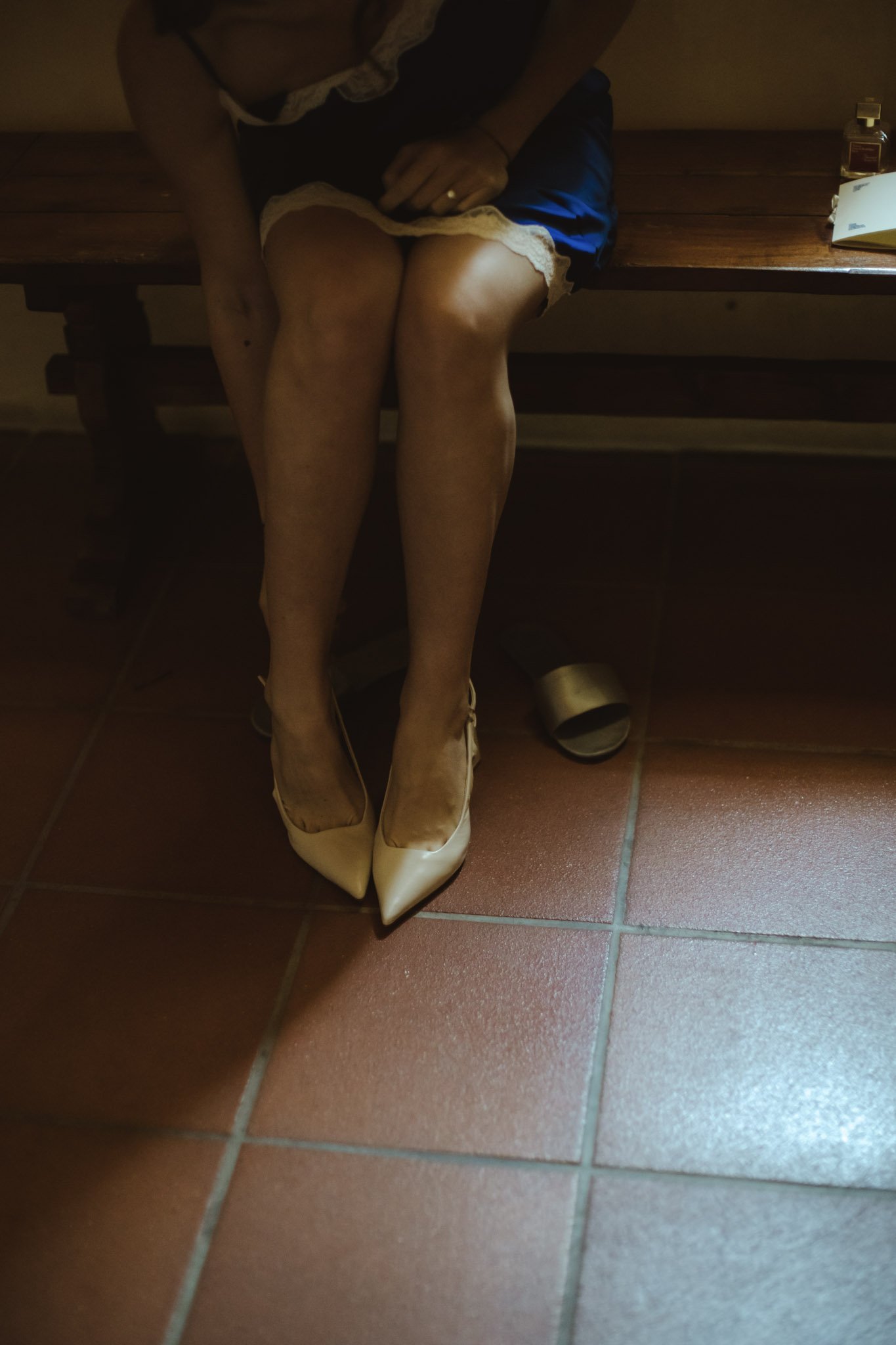 Bride putting on her shoes during a luxury wedding in Italy.