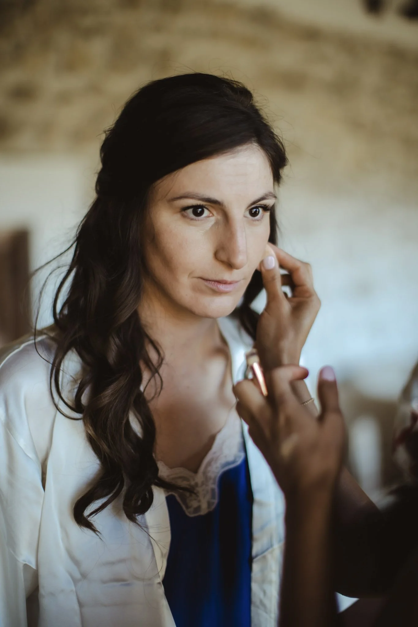 Bridal preparation in an Italian suite for a destination wedding
