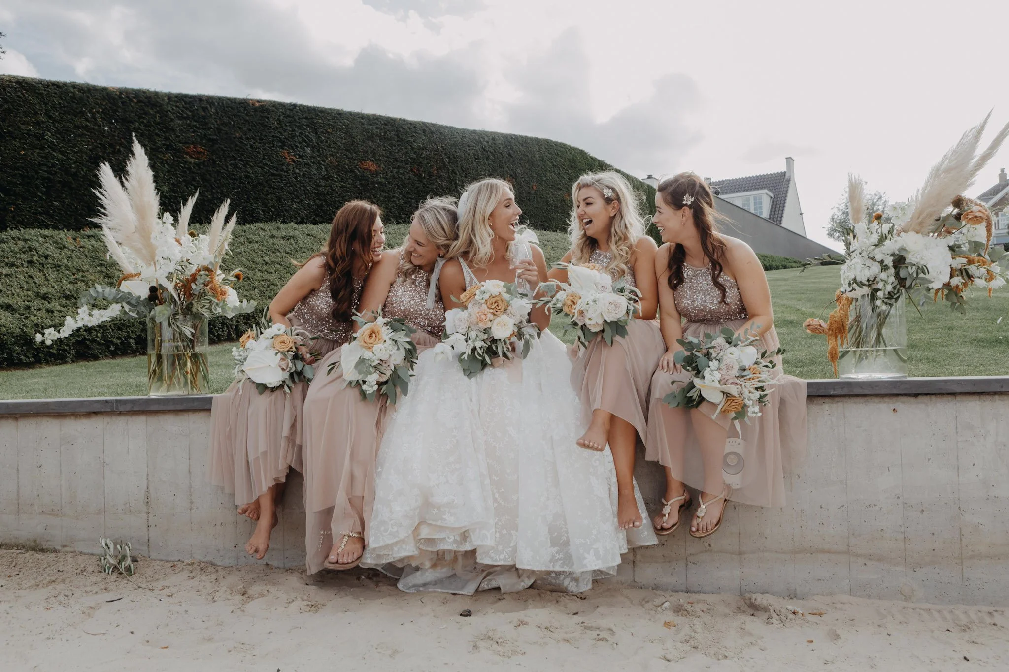 Bride laughing with her bridesmaids during a destination wedding in Kerkdriel.