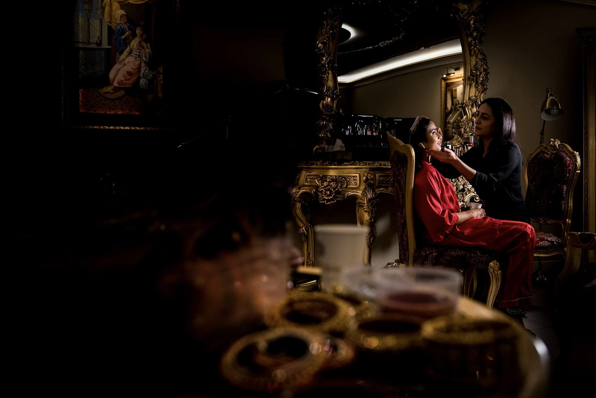 Elegant Indian bride having her makeup and hair done before her wedding in Rotterdam.