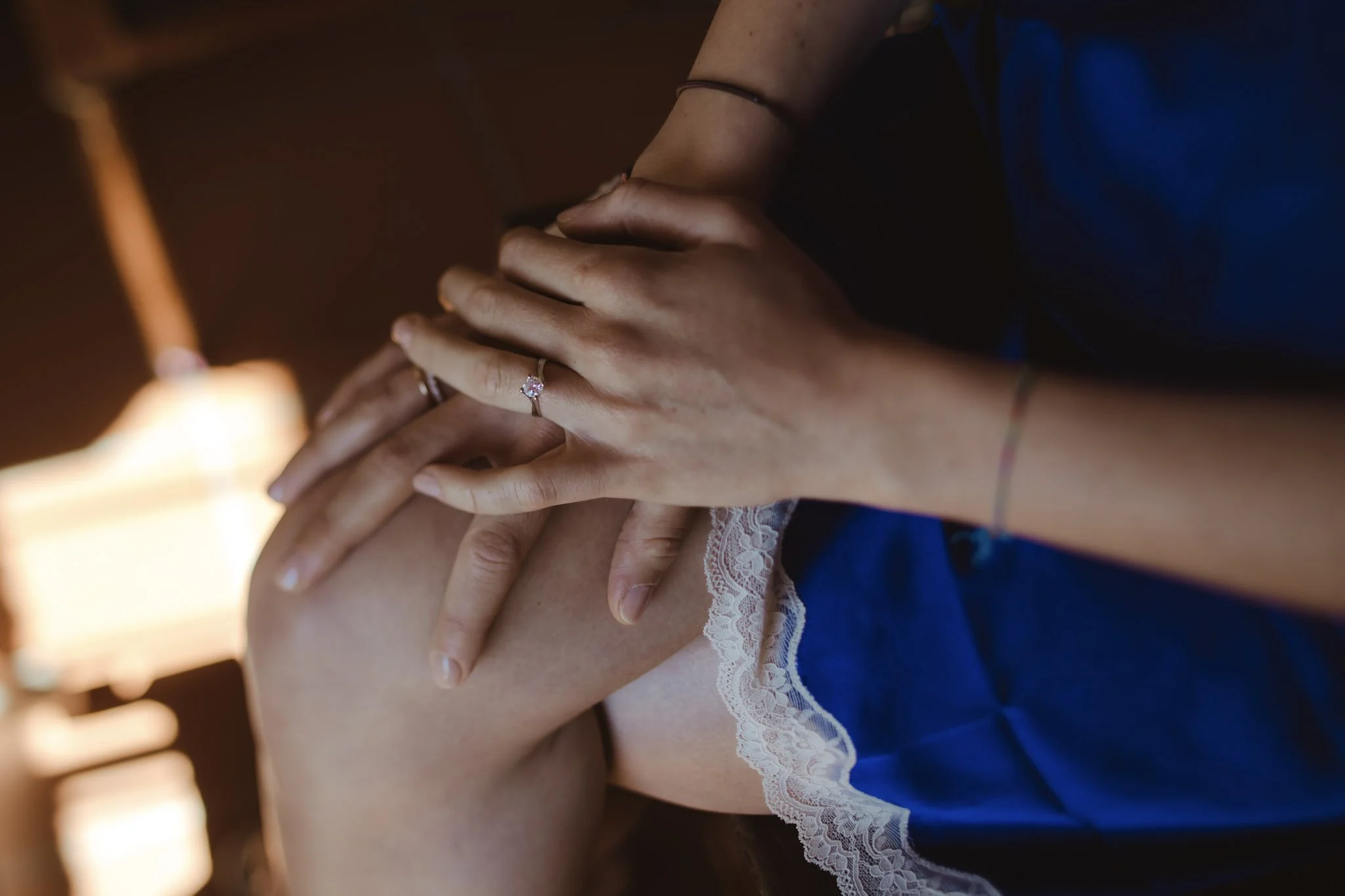 Bride getting ready for her luxury wedding in Italy wearing something blue.