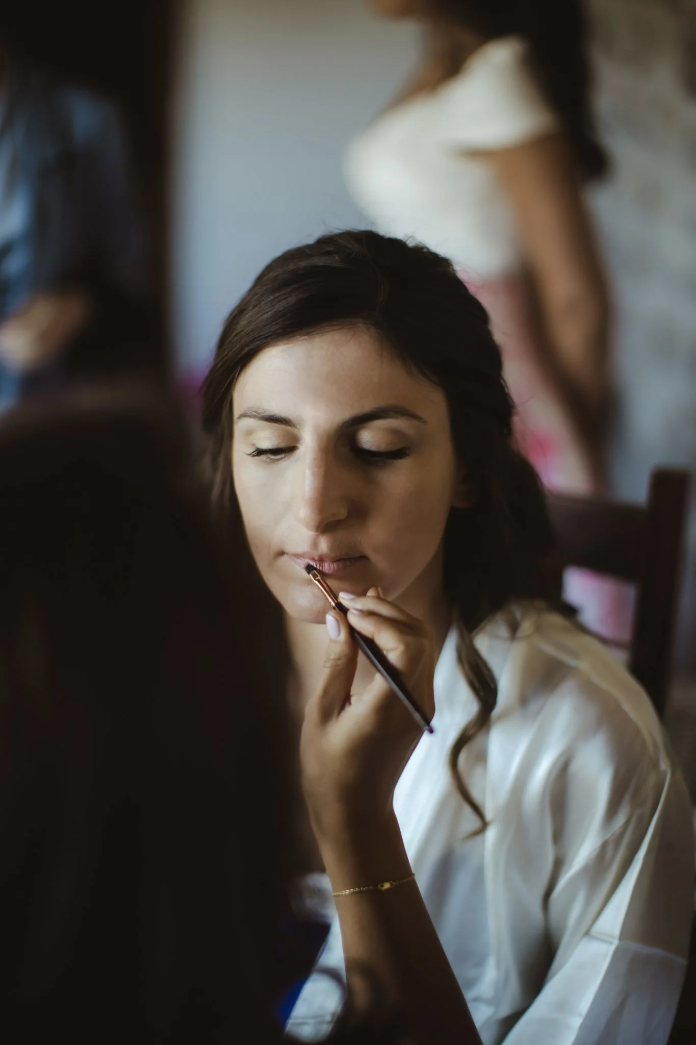 Morning of the wedding with the bride receiving soft romantic glam in Italy.
