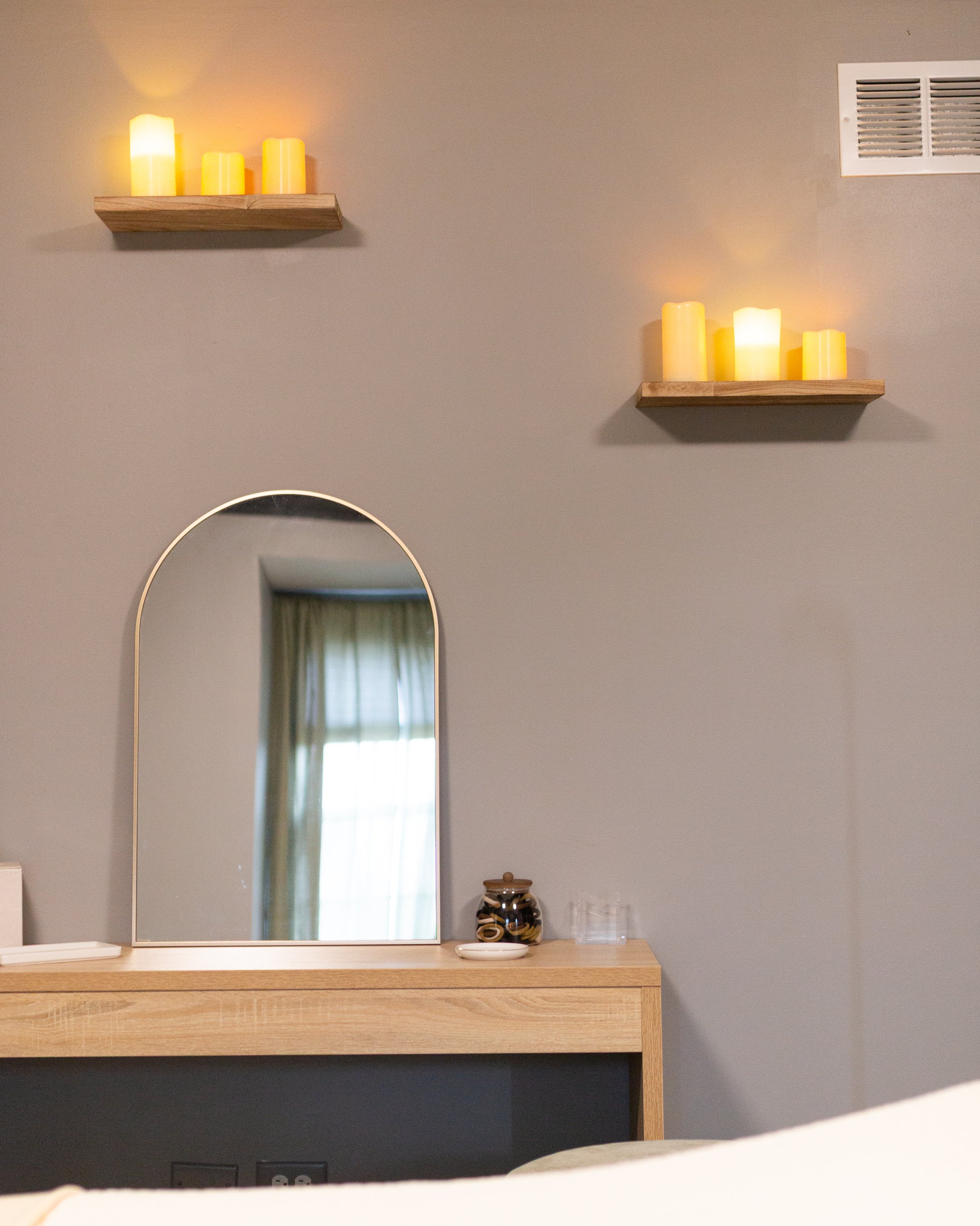 In touch bodywork massage room with mirror and floating lights.jpg