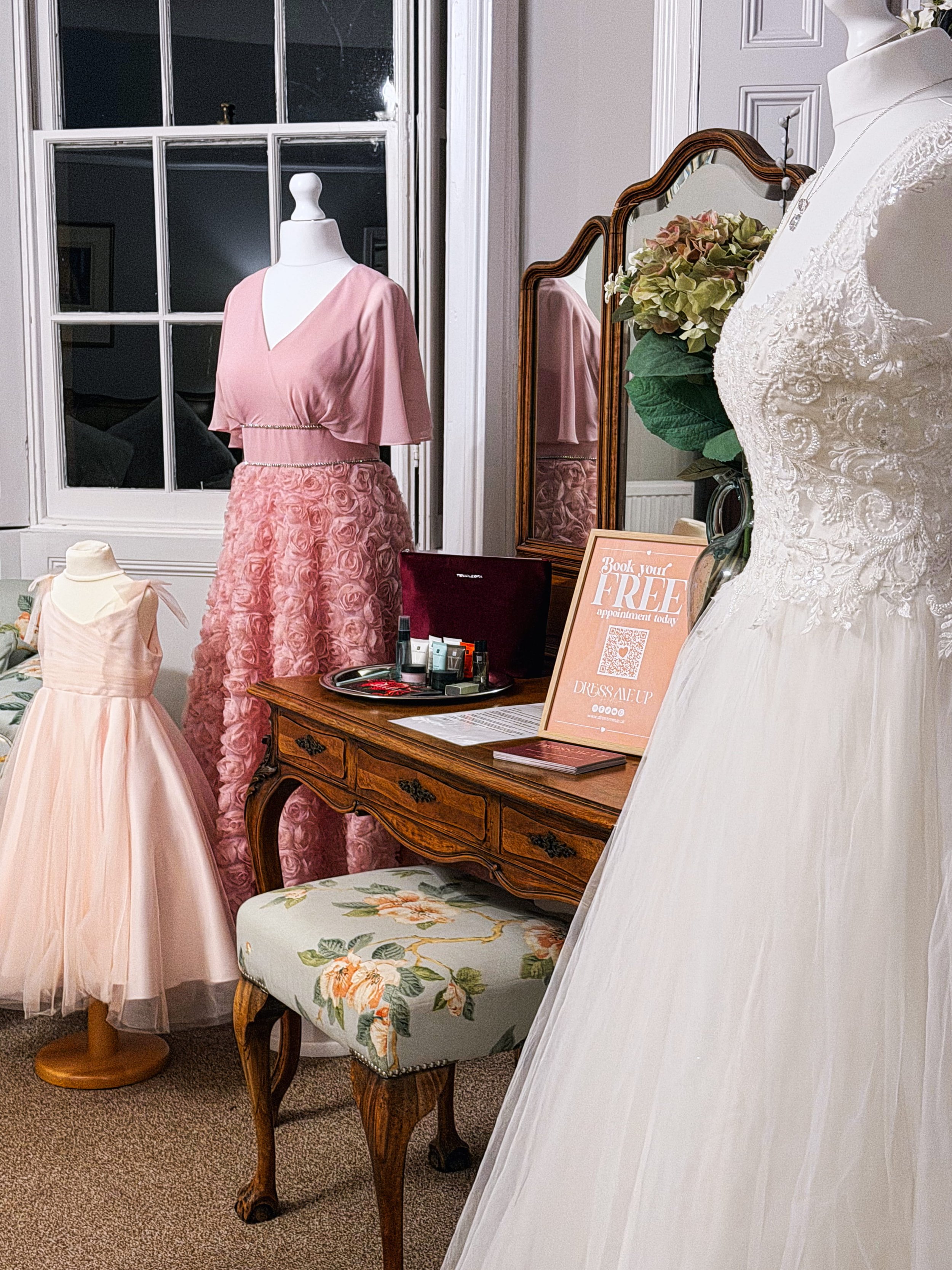 Bridal gown on display in a light-filled bedroom at Skendleby Hall wedding venue.jpg