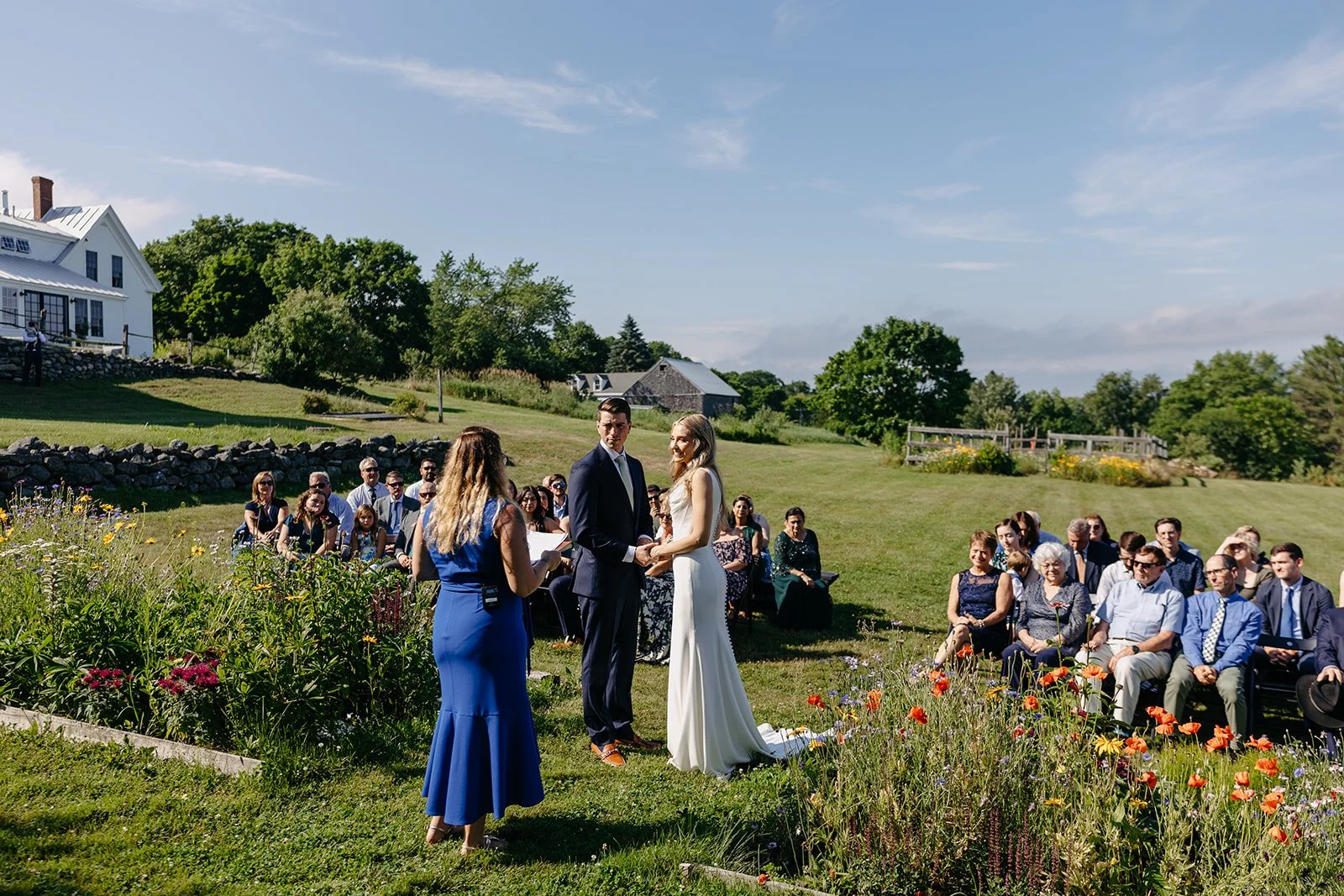 bright and warm photography for a summer ceremony at tops'l farm wedding venue