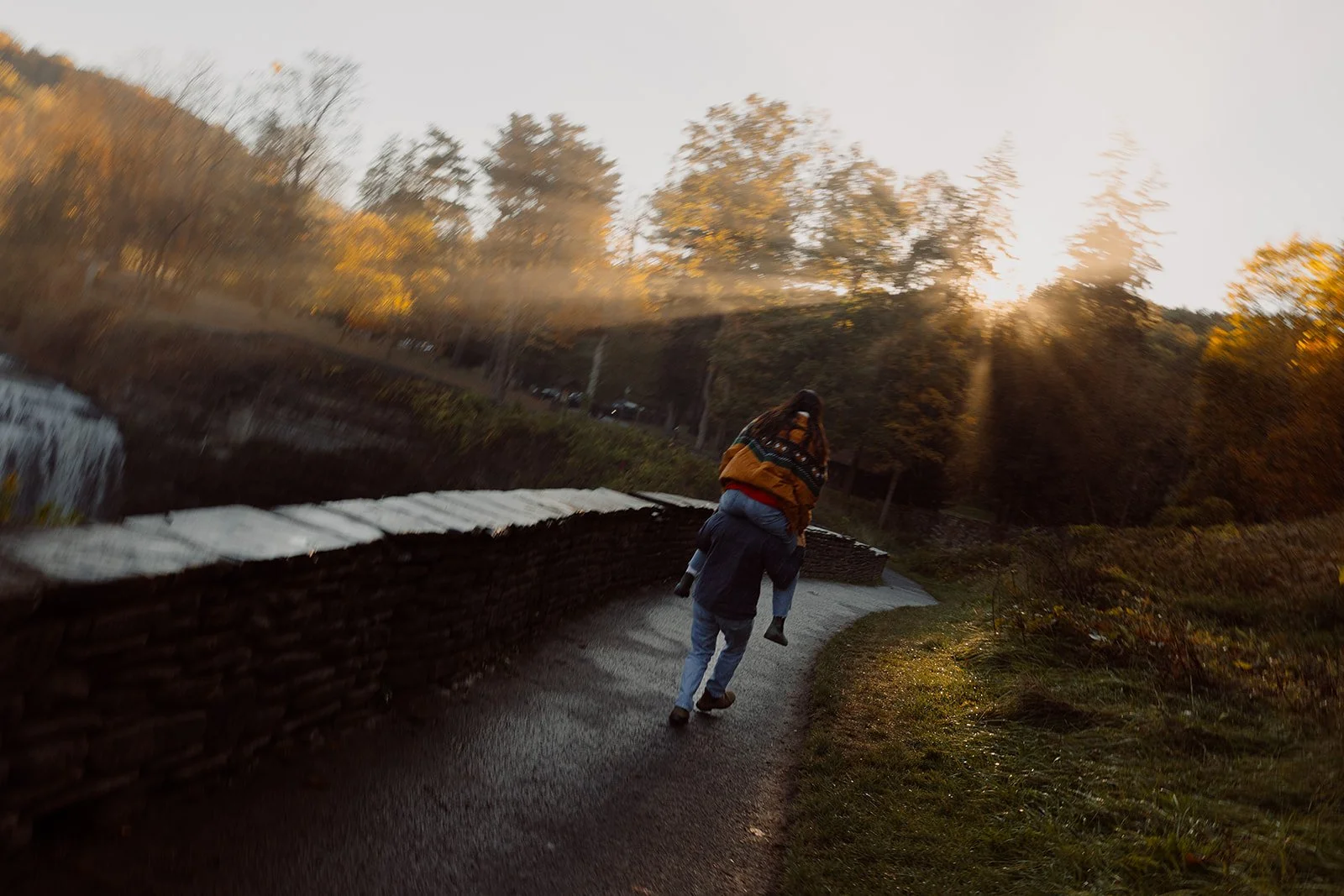 running into the sunset at letchworth state park with this engaged couple