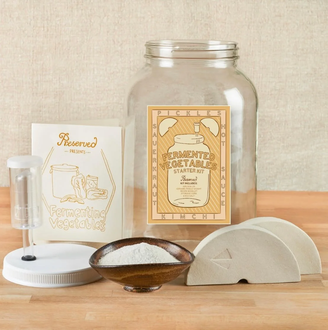 The Fermented Veggie Kit from Preserved is the perfect gift for the pickle-lover and DIY enthusiast. Learn to make your own sauerkraut, kimchi, kosher-style dills, mixed pickles, hot sauce, preserved lemons and more! This kit includes a gallon glass 