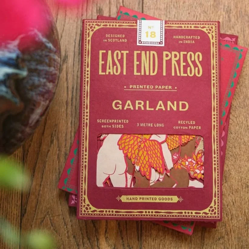 Sixteen playful cupids soar across this festive Valentine garland, each one ready to stir up a little romance with a well-aimed arrow. Screen printed by hand in rich, cheerful tones, this piece brings a touch of whimsy to Valentine's Day celebrations